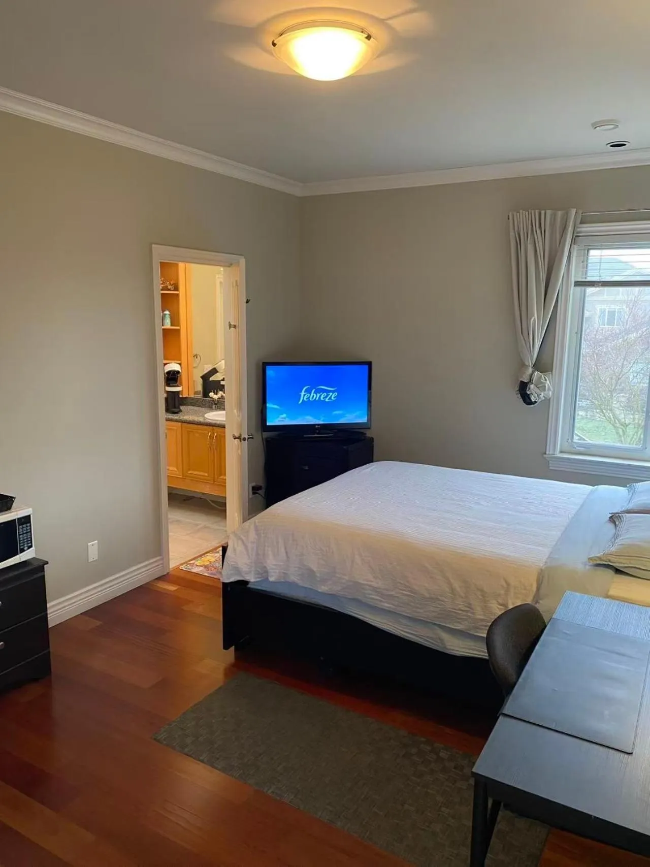 Bed in A cozy independent entrance bedroom with a private washroom close to YVR Richmond