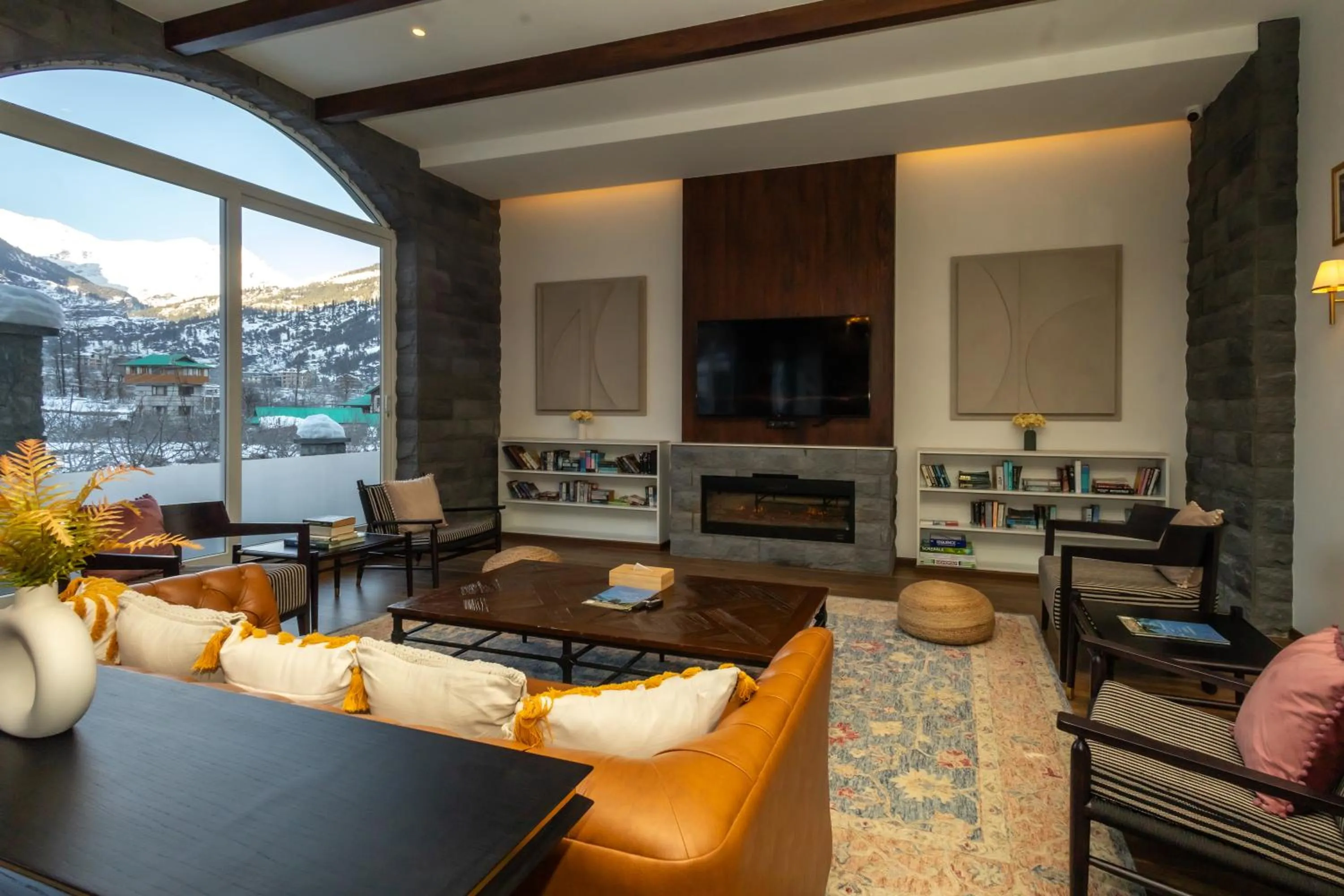 Communal lounge/ TV room in Nivasana Manali - A Luxury Boutique Hotel