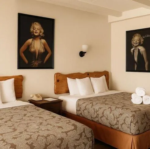 Bed in Highlander Motel