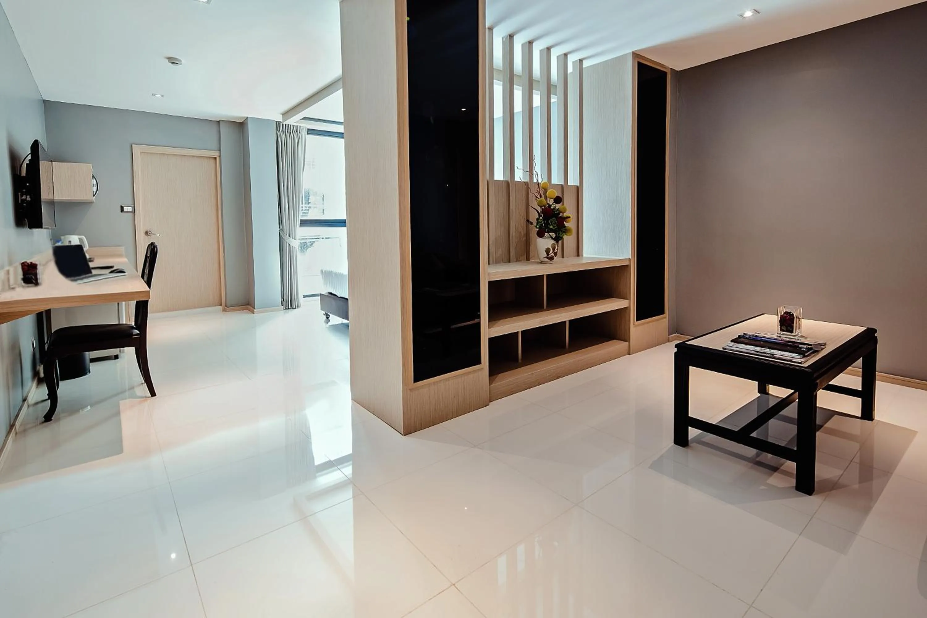 Living room in Three Sukhumvit Hotel - SHA Plus Certified