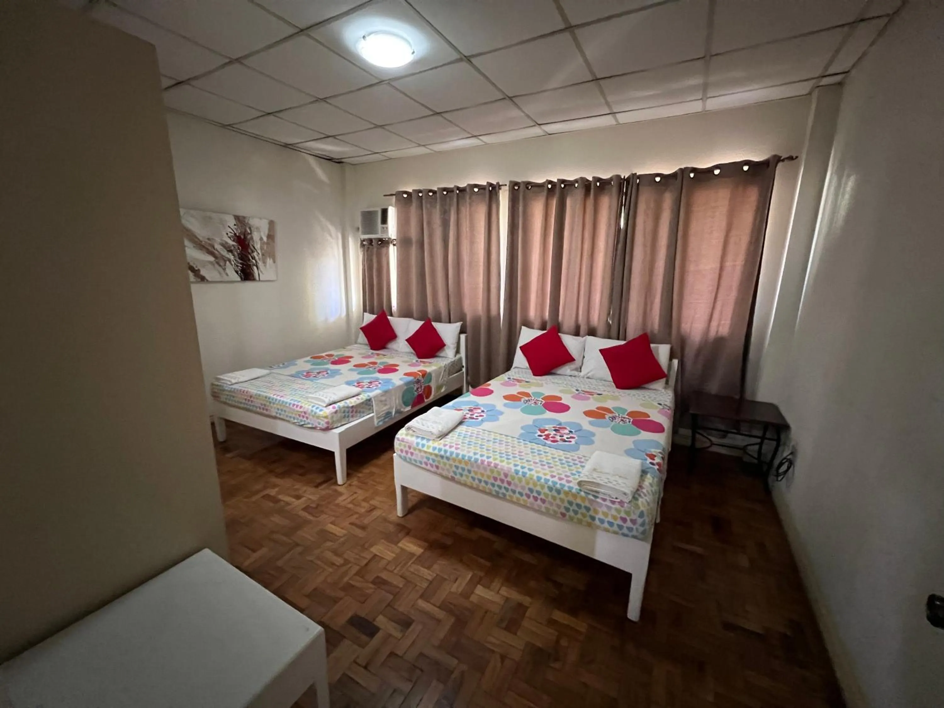 Bed in Golden Belle Apartelle and Suites