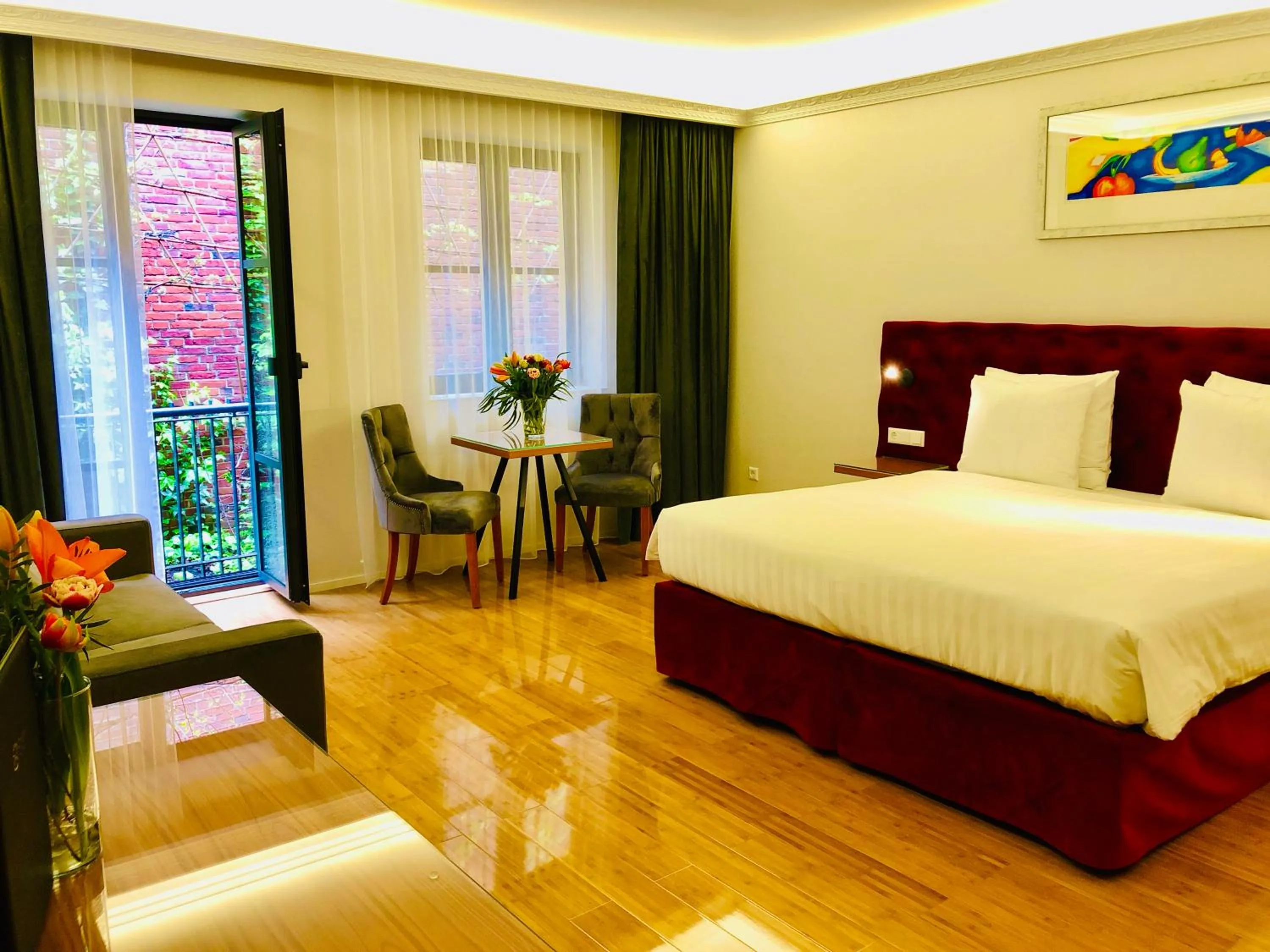 Seating area, Bed in Chasse Residency Hotel