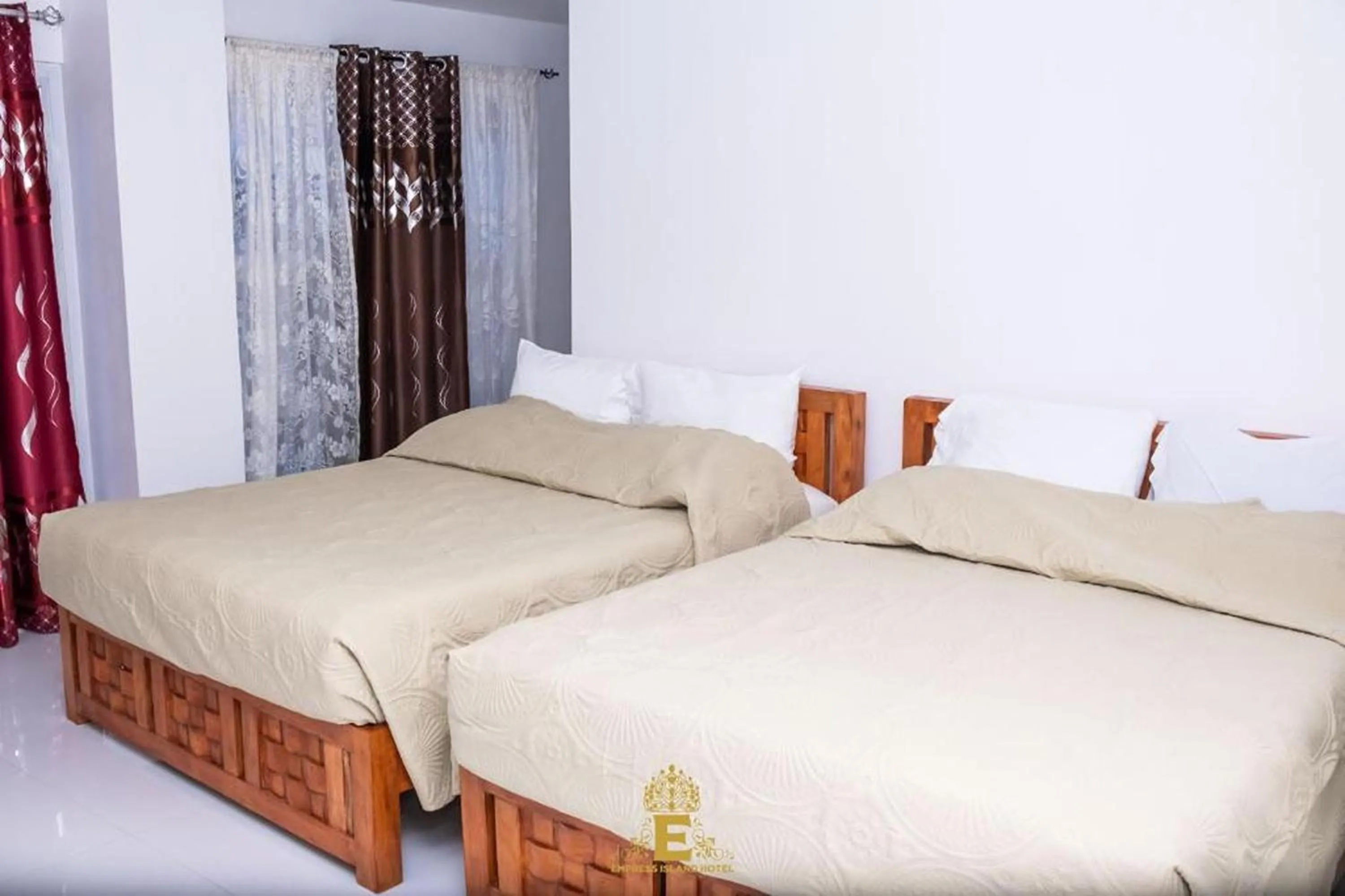 Bed in Empress Island Hotel