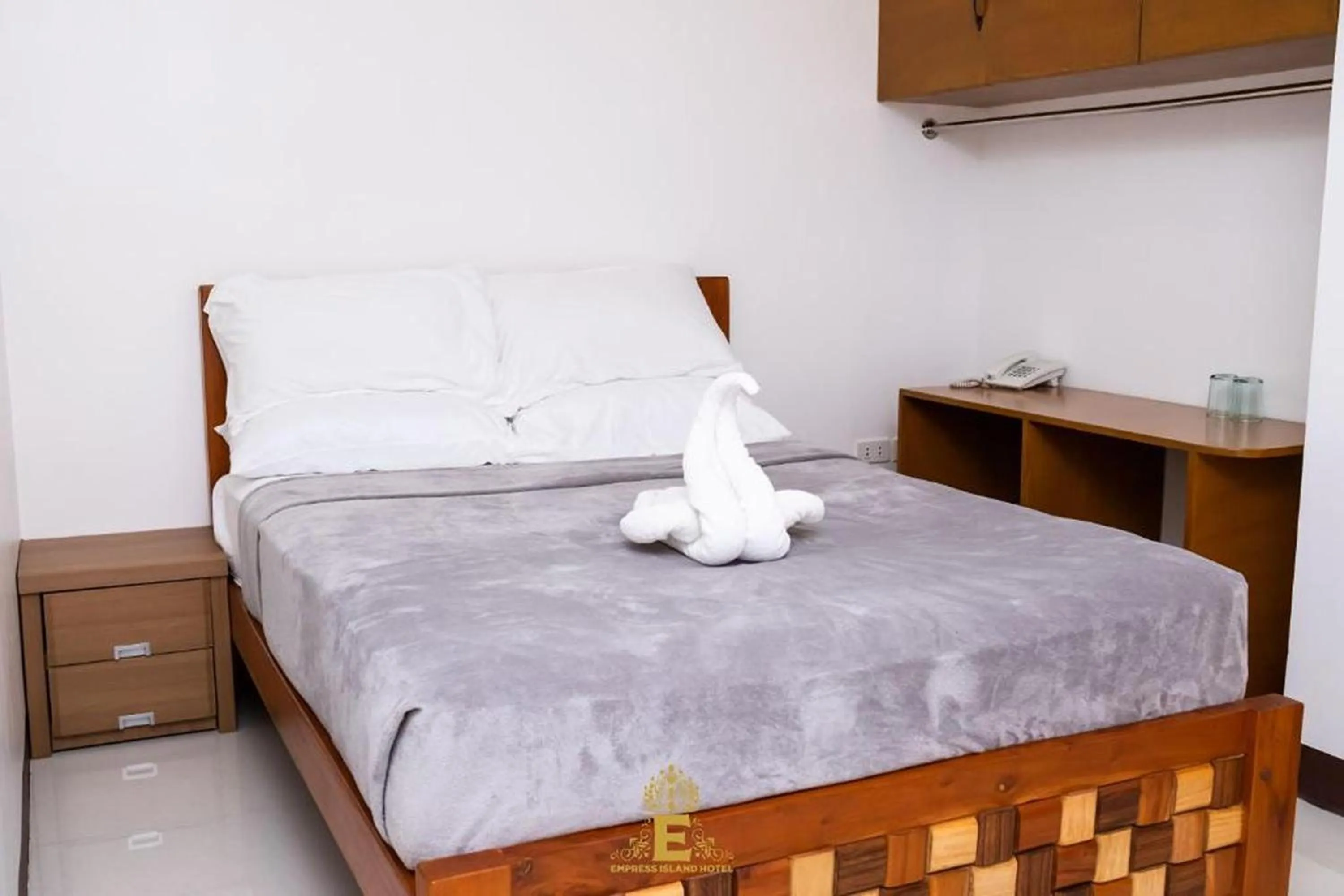 Bed in Empress Island Hotel