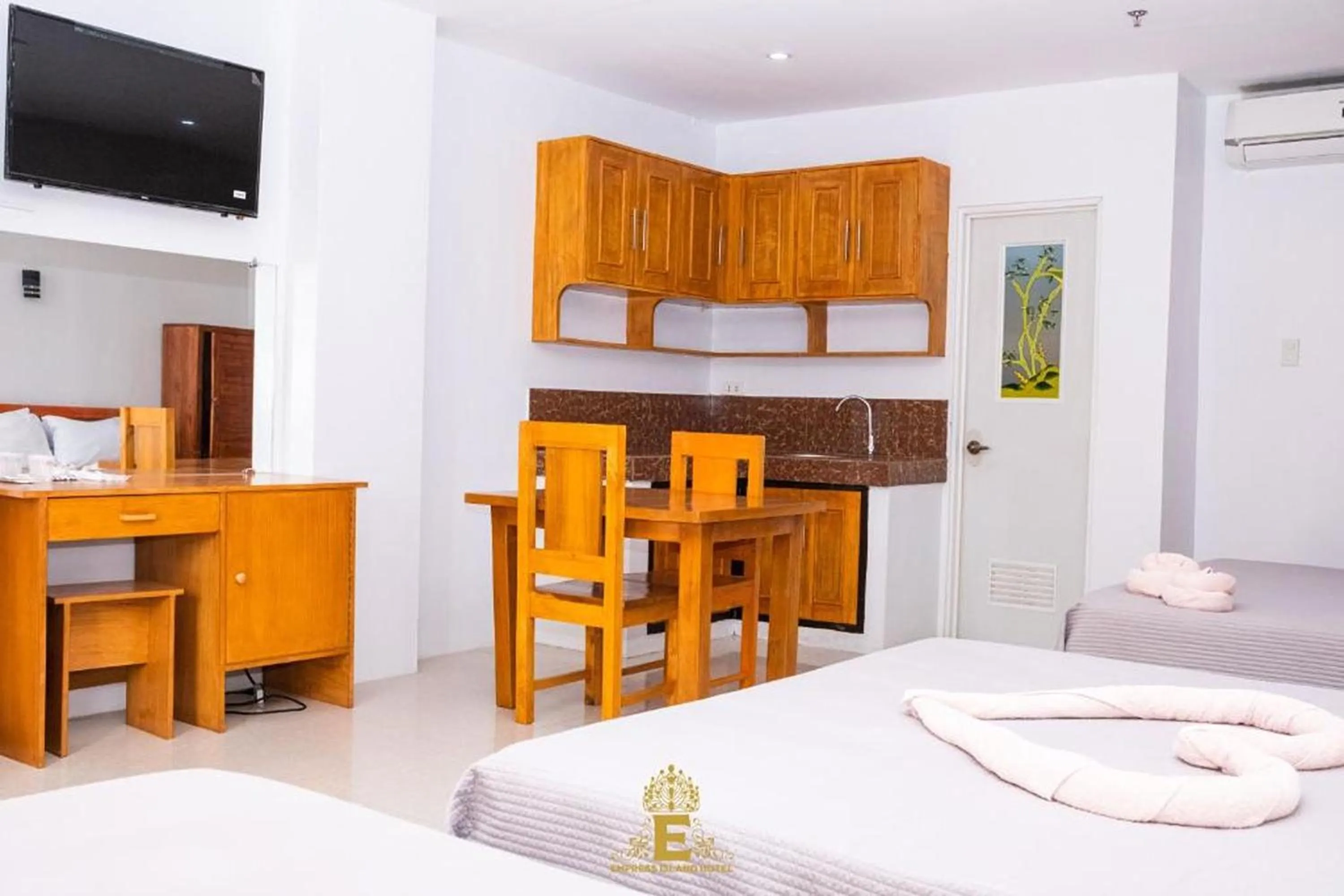 Bed in Empress Island Hotel