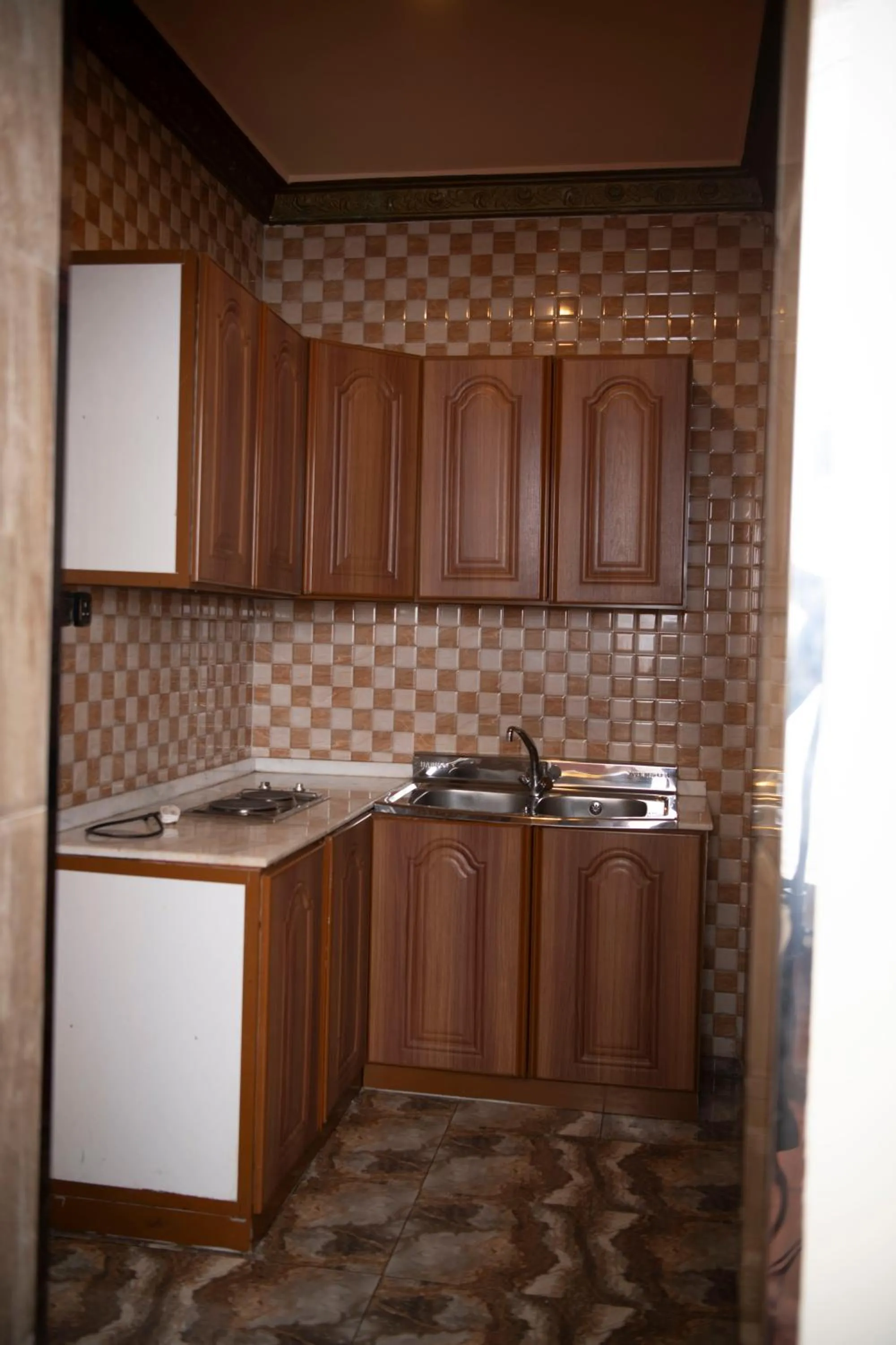 Kitchen or kitchenette in Al Nabarees Al Masi Hotel
