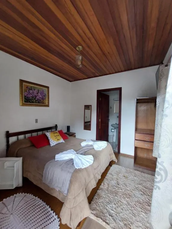 Bed in Pousada dos Marins