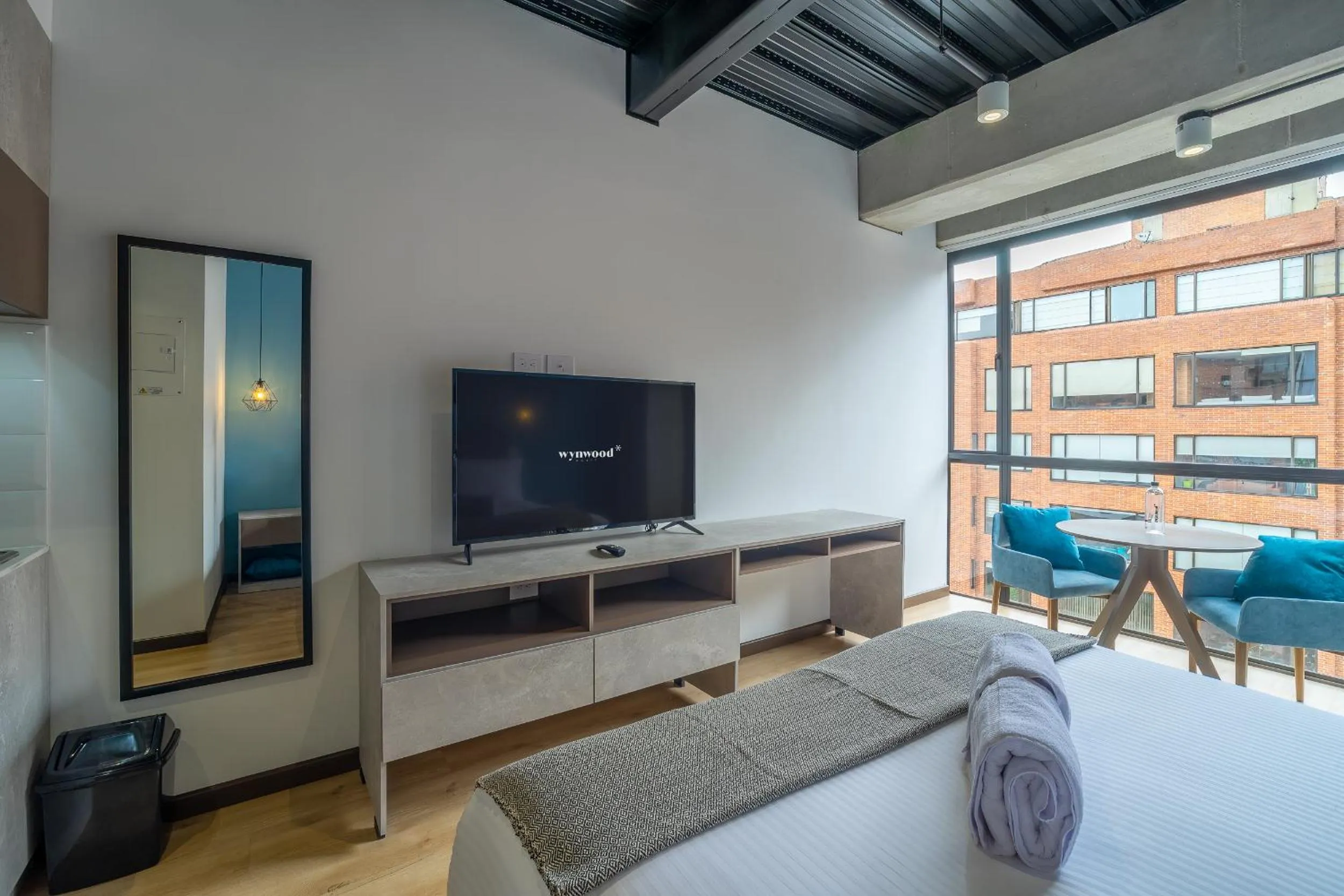 Photo of the whole room, Bed in Beliving by Wynwood House