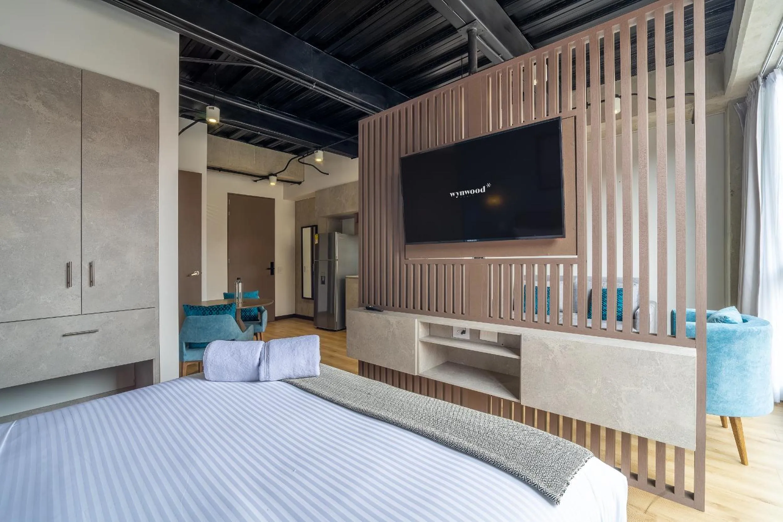 Bed in Beliving by Wynwood House