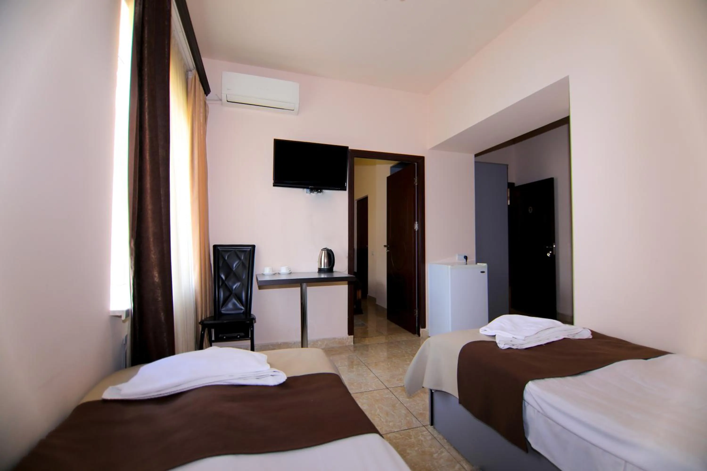 Bed in Comfort House Hotel