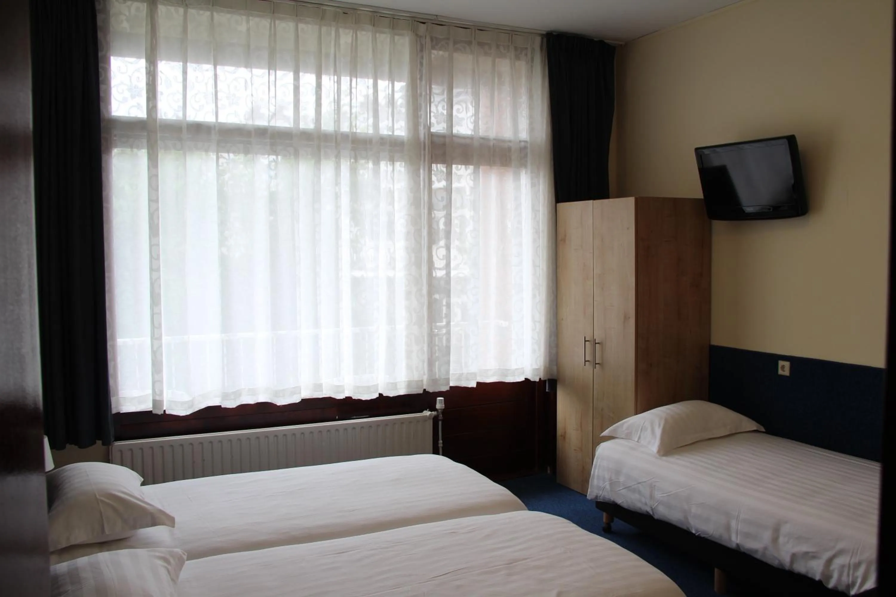 Bed in New City Hotel Scheveningen