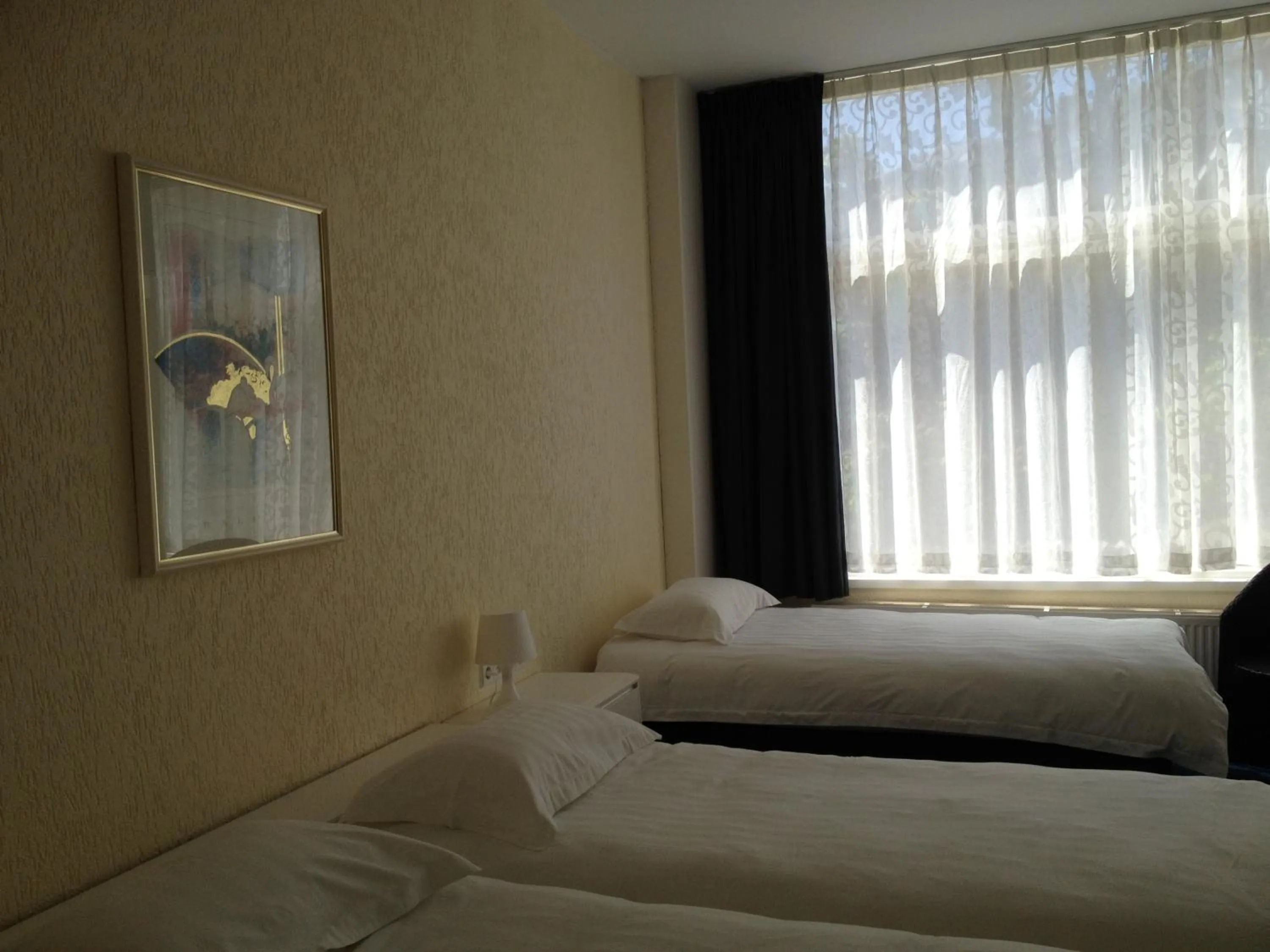 Bed in New City Hotel Scheveningen