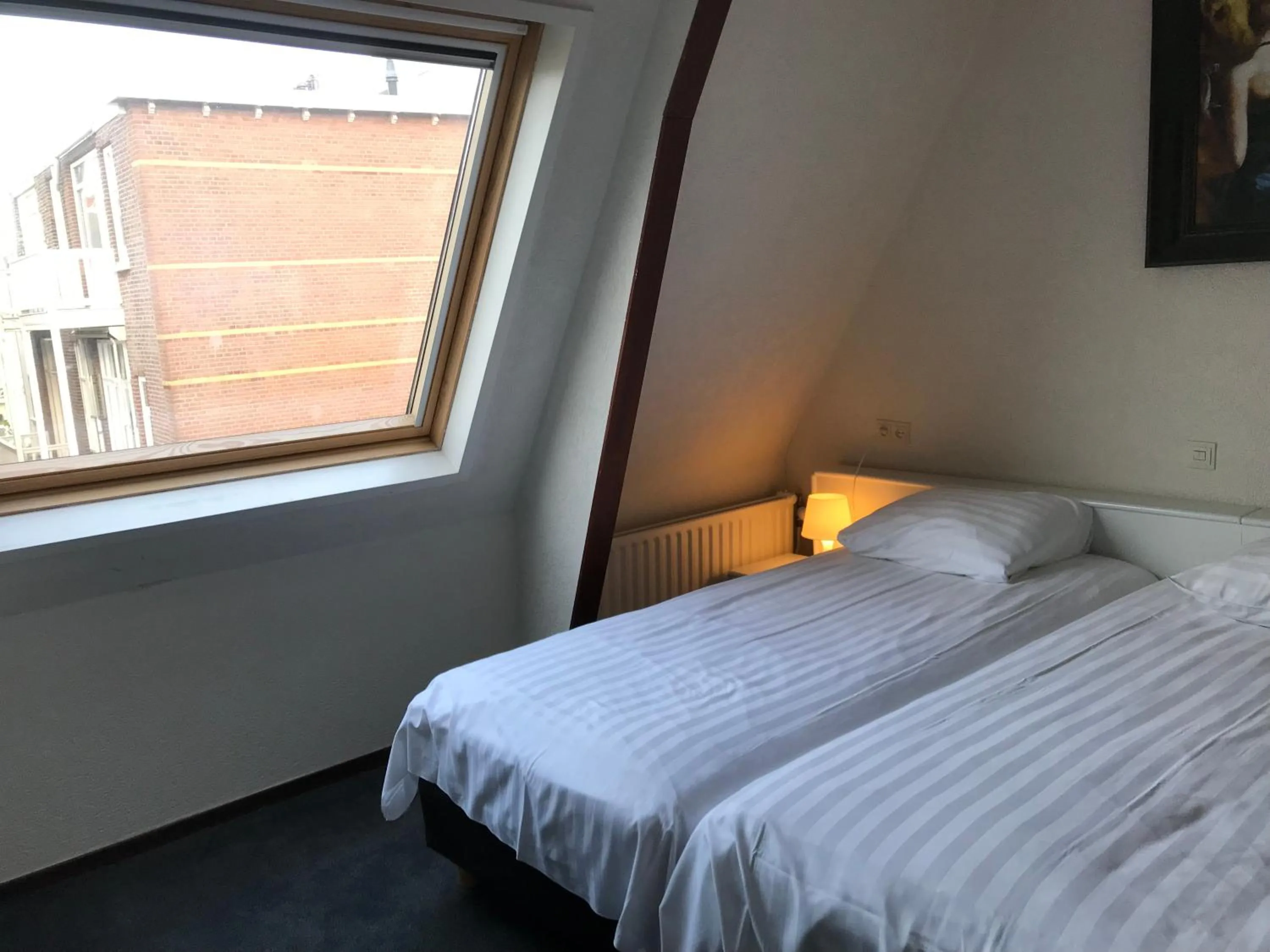 Bed in New City Hotel Scheveningen