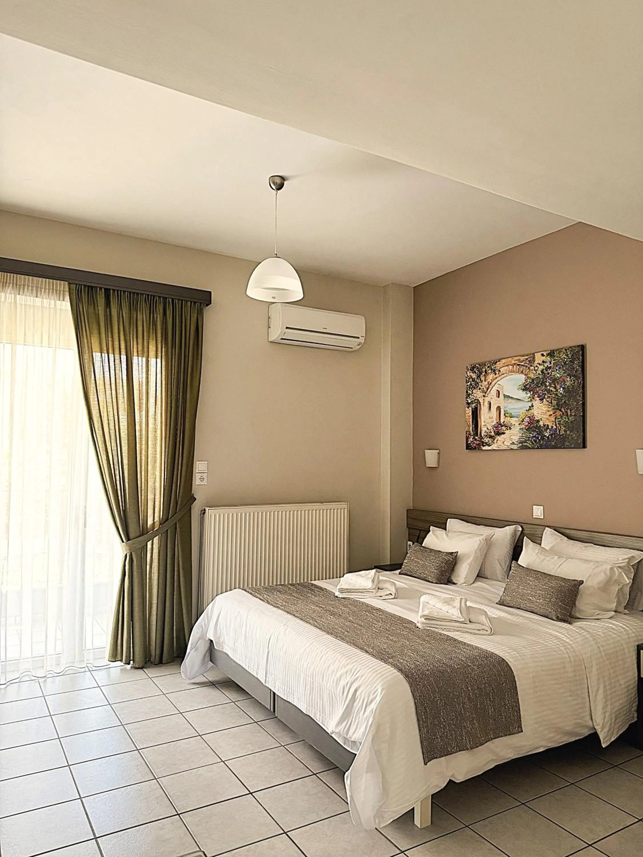 Bed in Vesperi Studios & Apartments