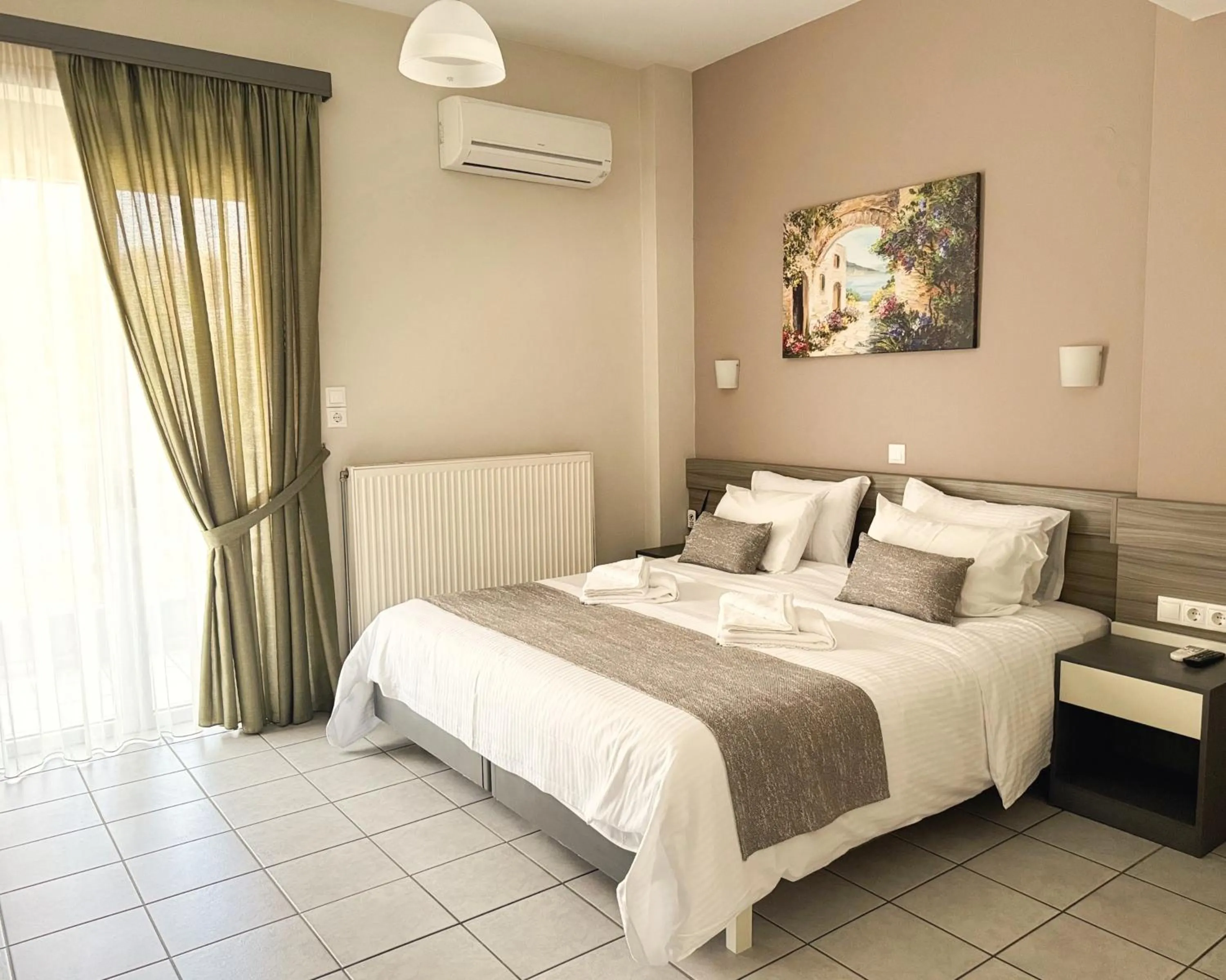 Bed in Vesperi Studios & Apartments