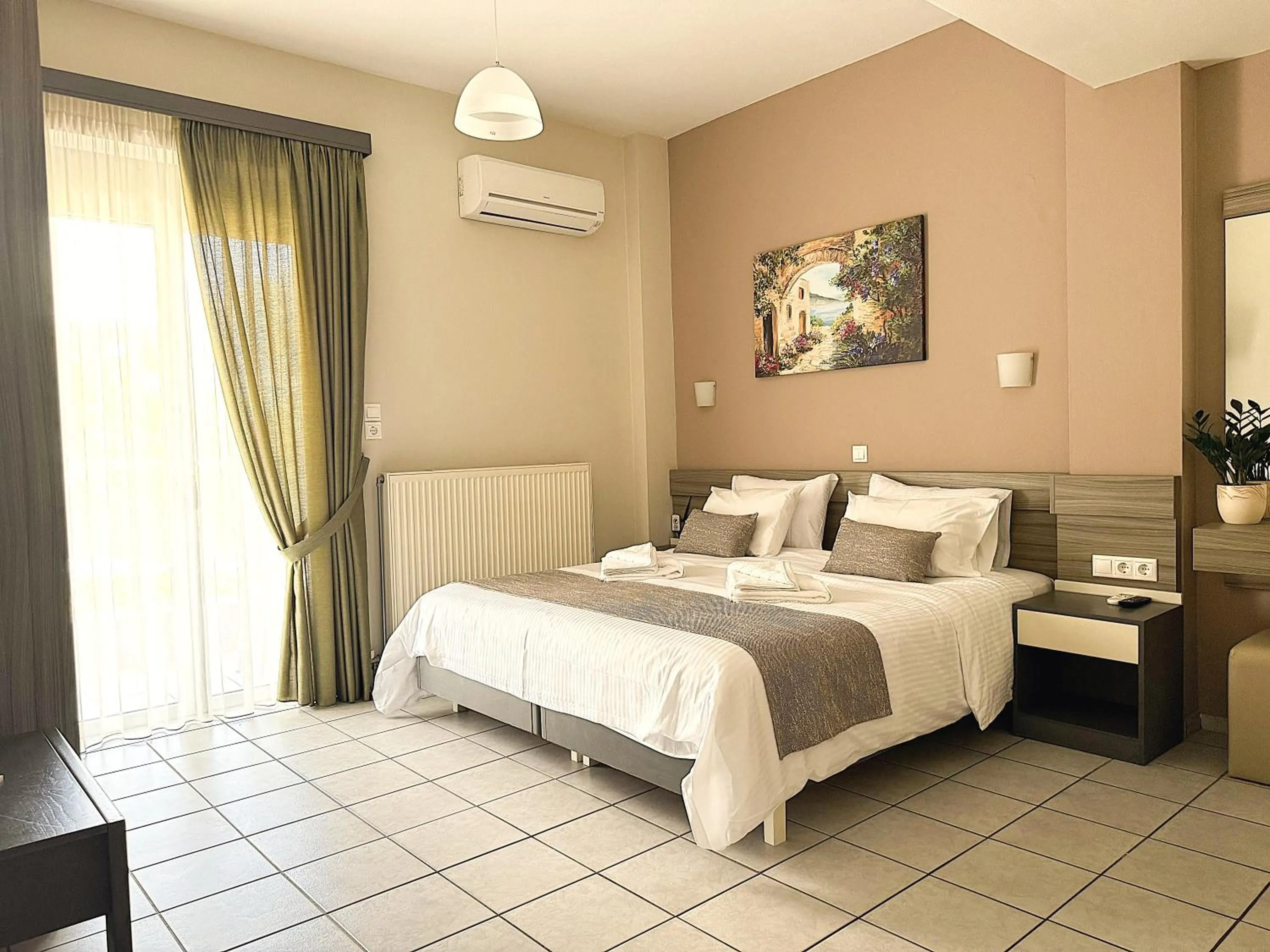 Bed in Vesperi Studios & Apartments