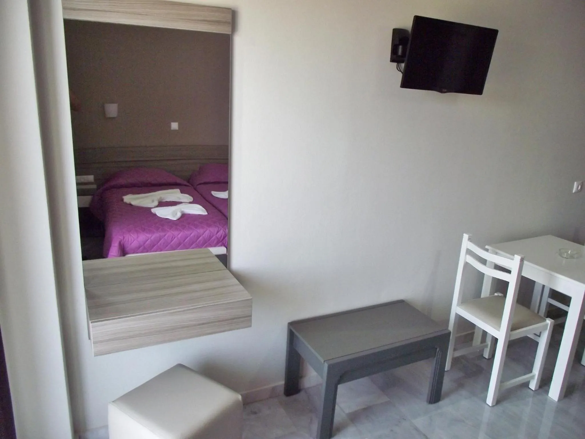 Bed in Vesperi Studios & Apartments