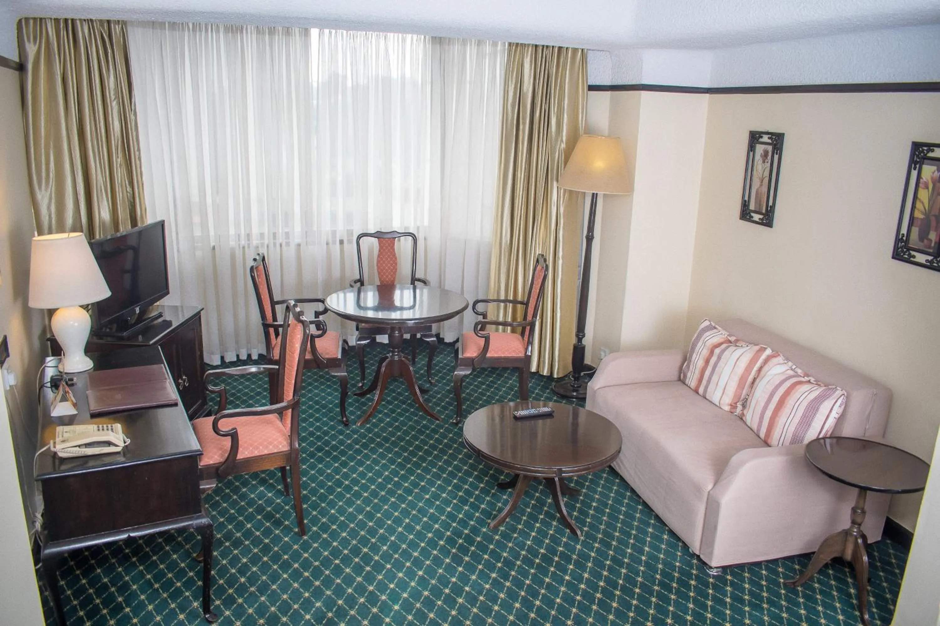 Living room in Nairobi Safari Club by Swiss-Belhotel
