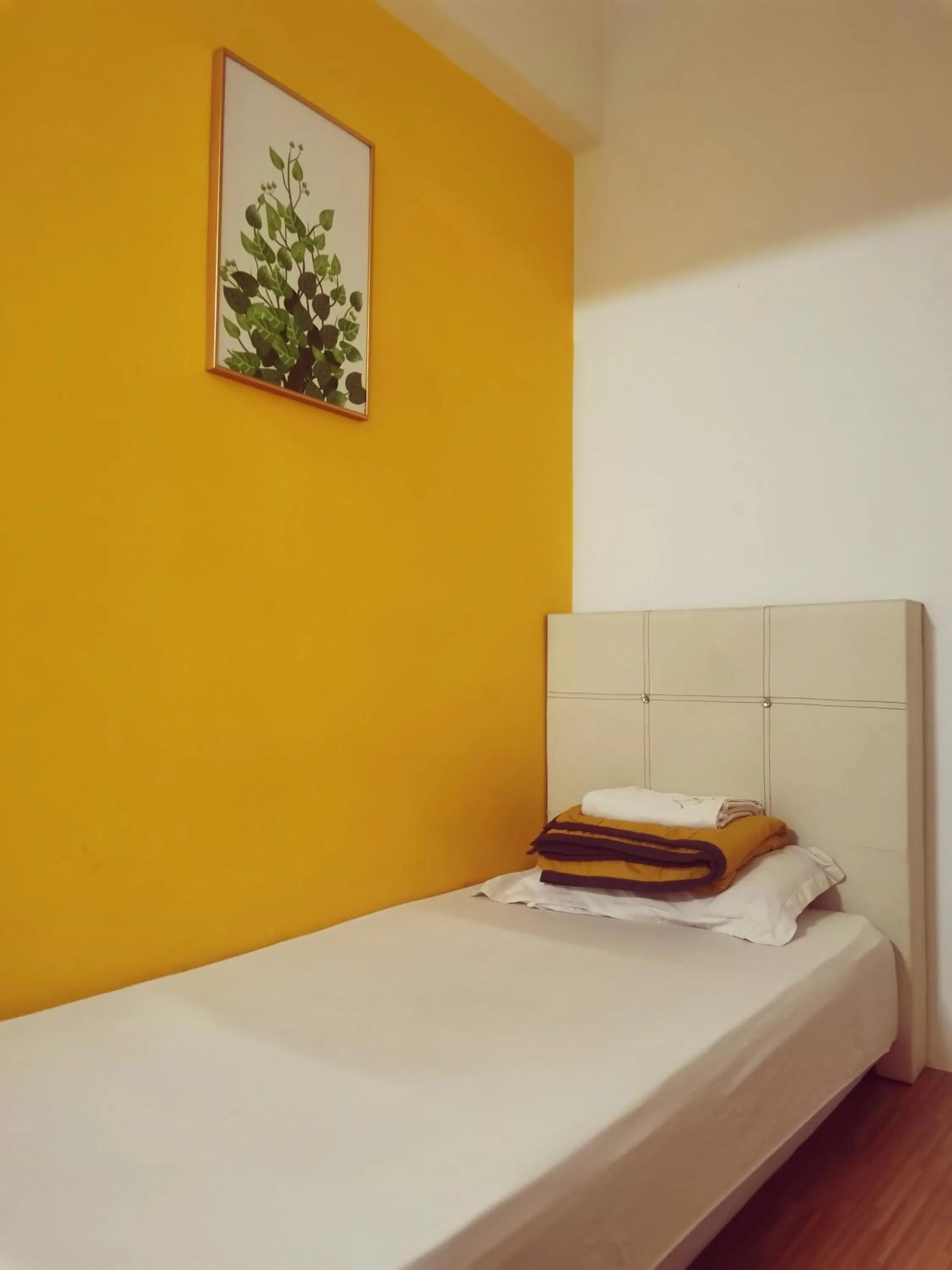 Bed in Sabai Sabai Guesthouse in Bayan Lepas