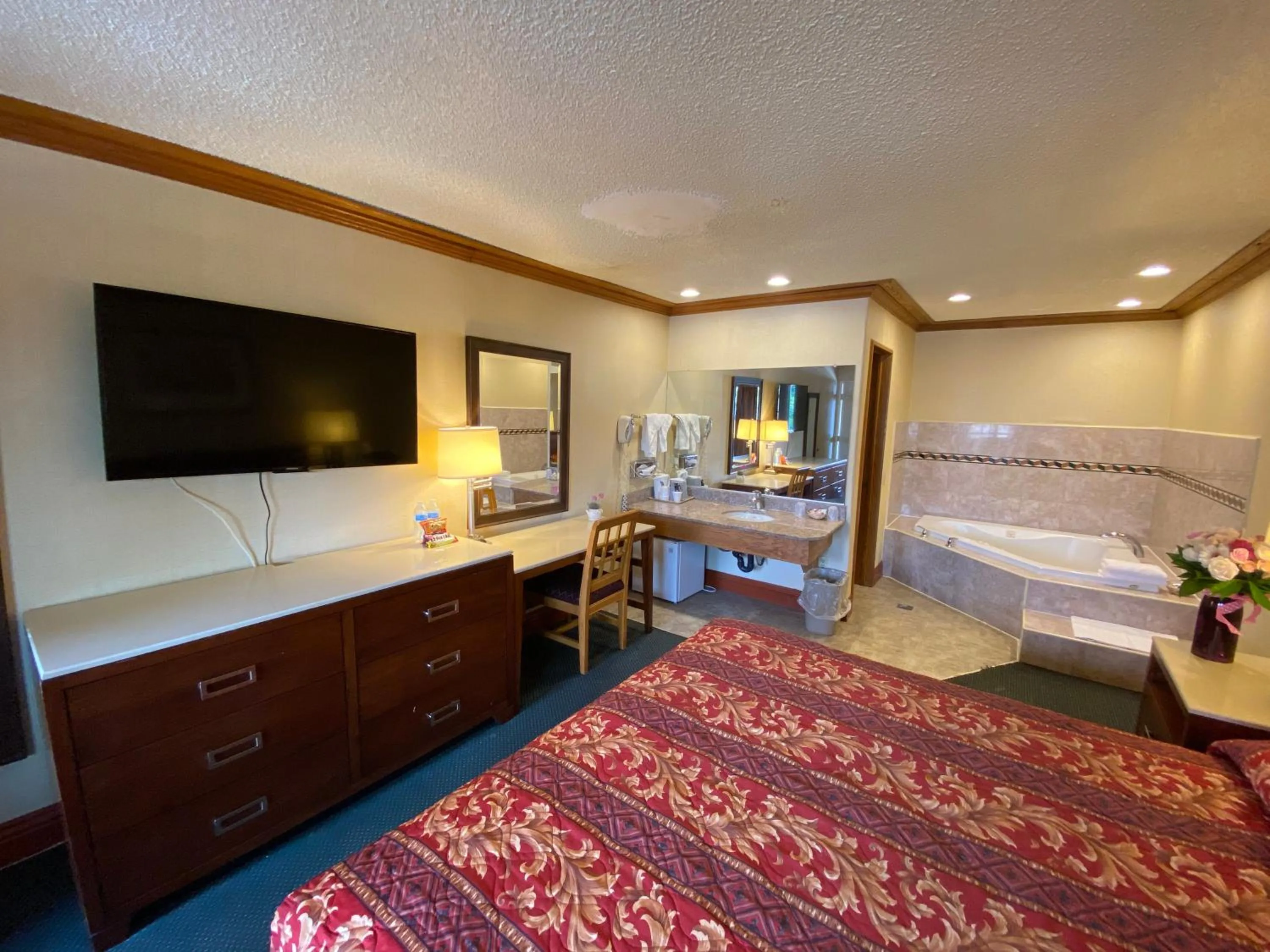 Photo of the whole room, Bed in New Century Inn
