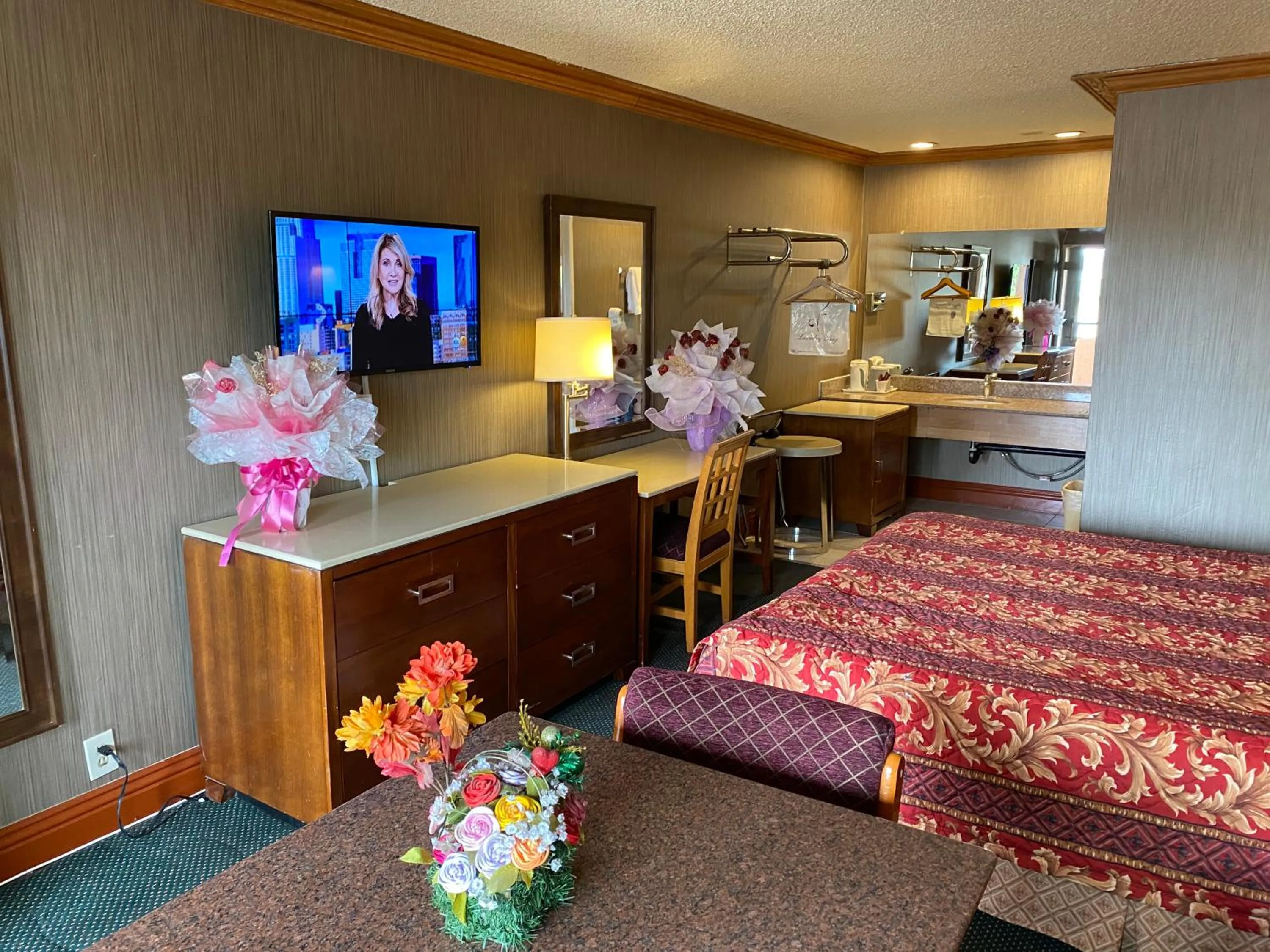 Photo of the whole room, Bed in New Century Inn
