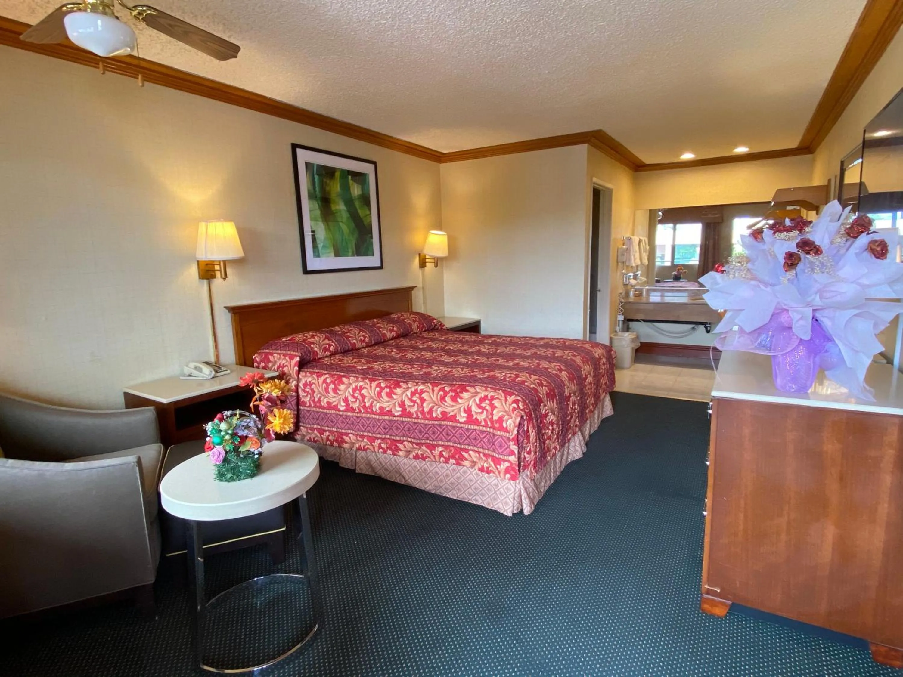 Photo of the whole room, Bed in New Century Inn