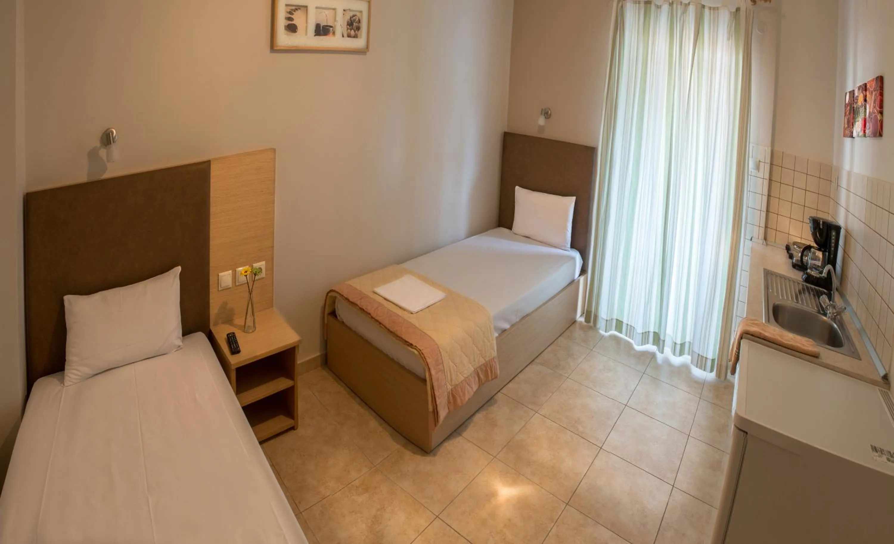 Kitchen or kitchenette, Bed in Nepheli Apartments and Studios