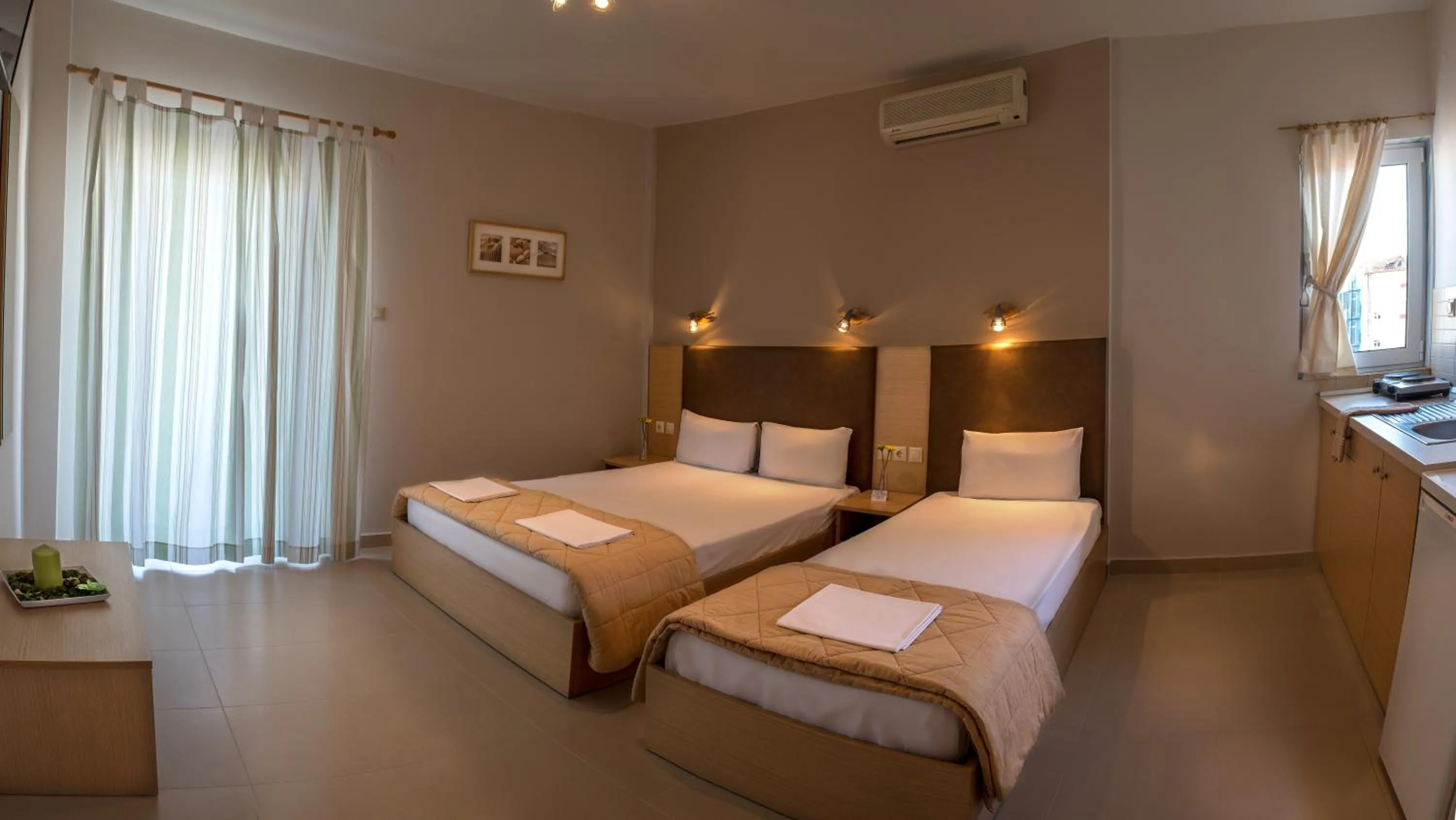 Kitchen or kitchenette, Bed in Nepheli Apartments and Studios