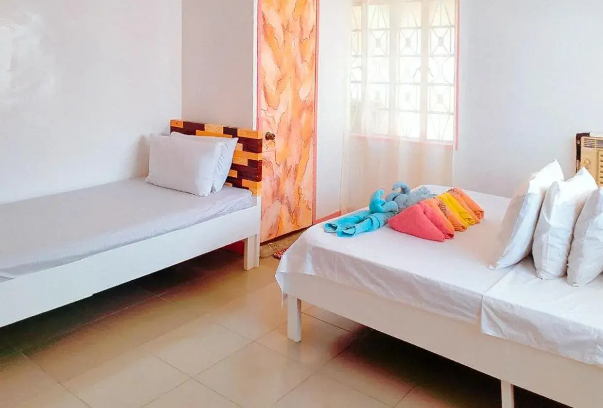 Bed in RedDoorz @ Jmalls Island Tourist Inn Dinagat Island Bed in RedDoorz @ Jmalls Island Tourist Inn Dinagat Island