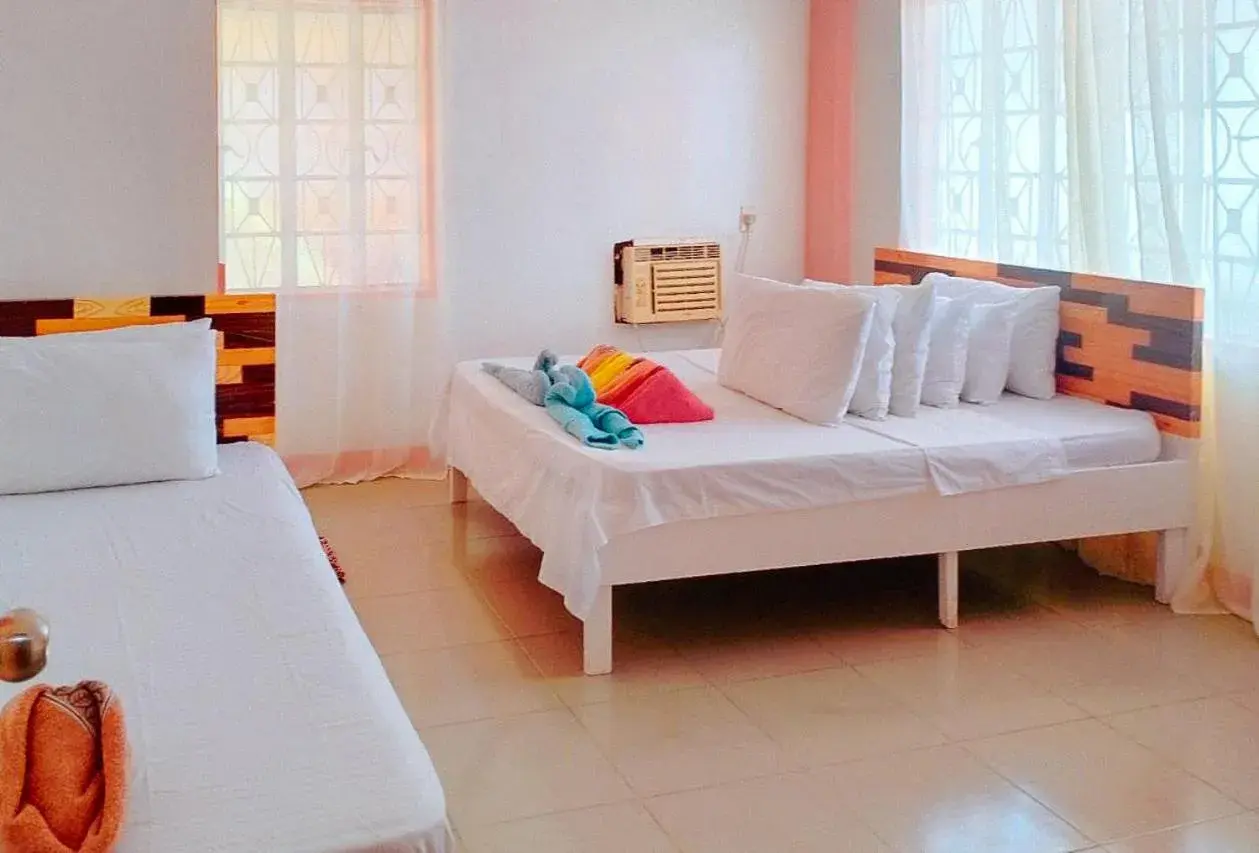 Bed in RedDoorz @ Jmalls Island Tourist Inn Dinagat Island Bed in RedDoorz @ Jmalls Island Tourist Inn Dinagat Island