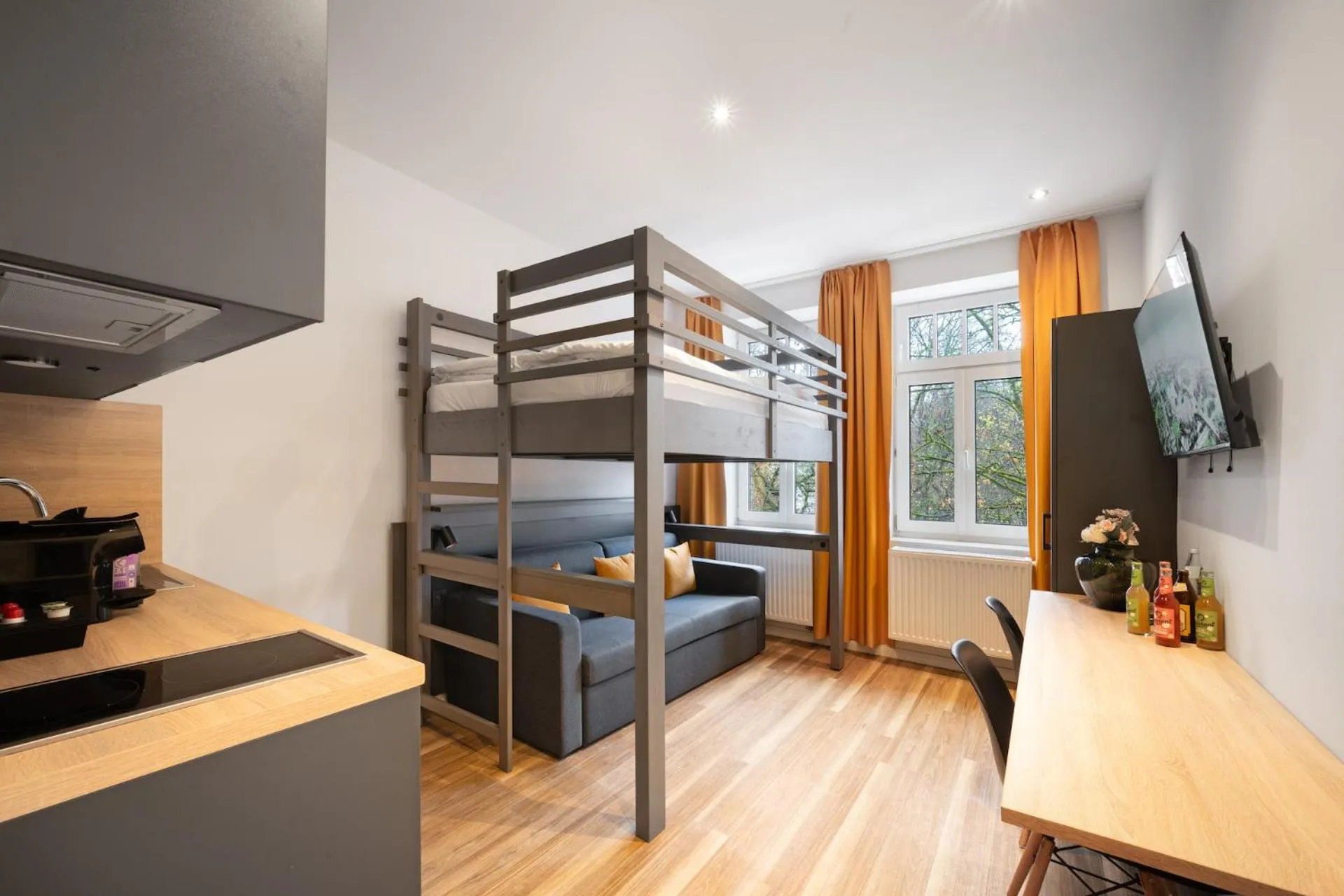 Bed in Servus Apartments by Homaris