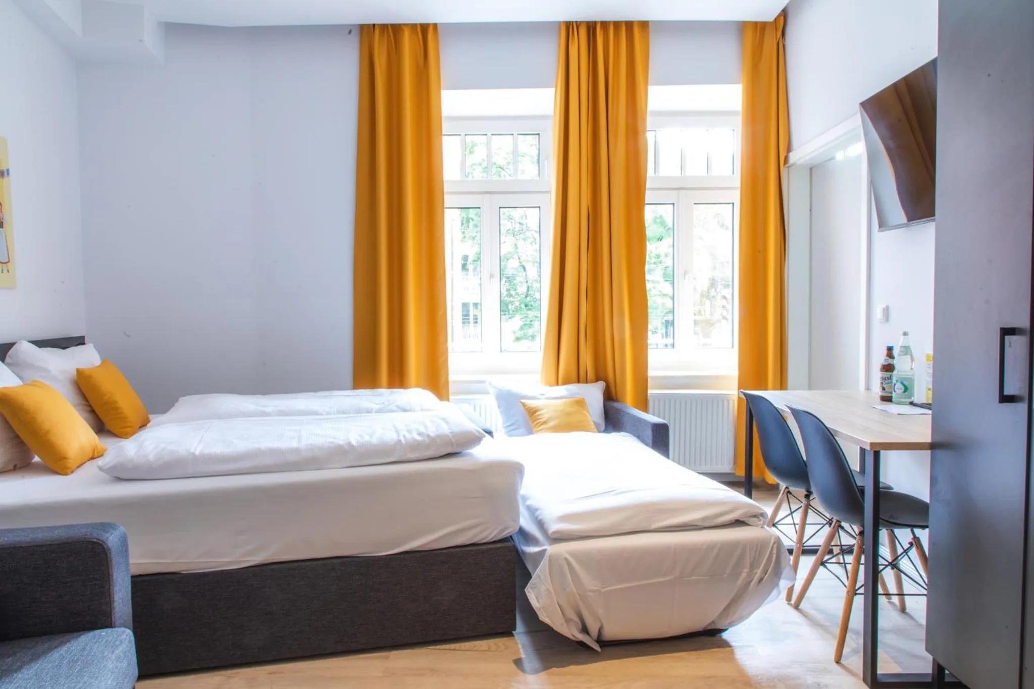 Bed in Servus Apartments by Homaris