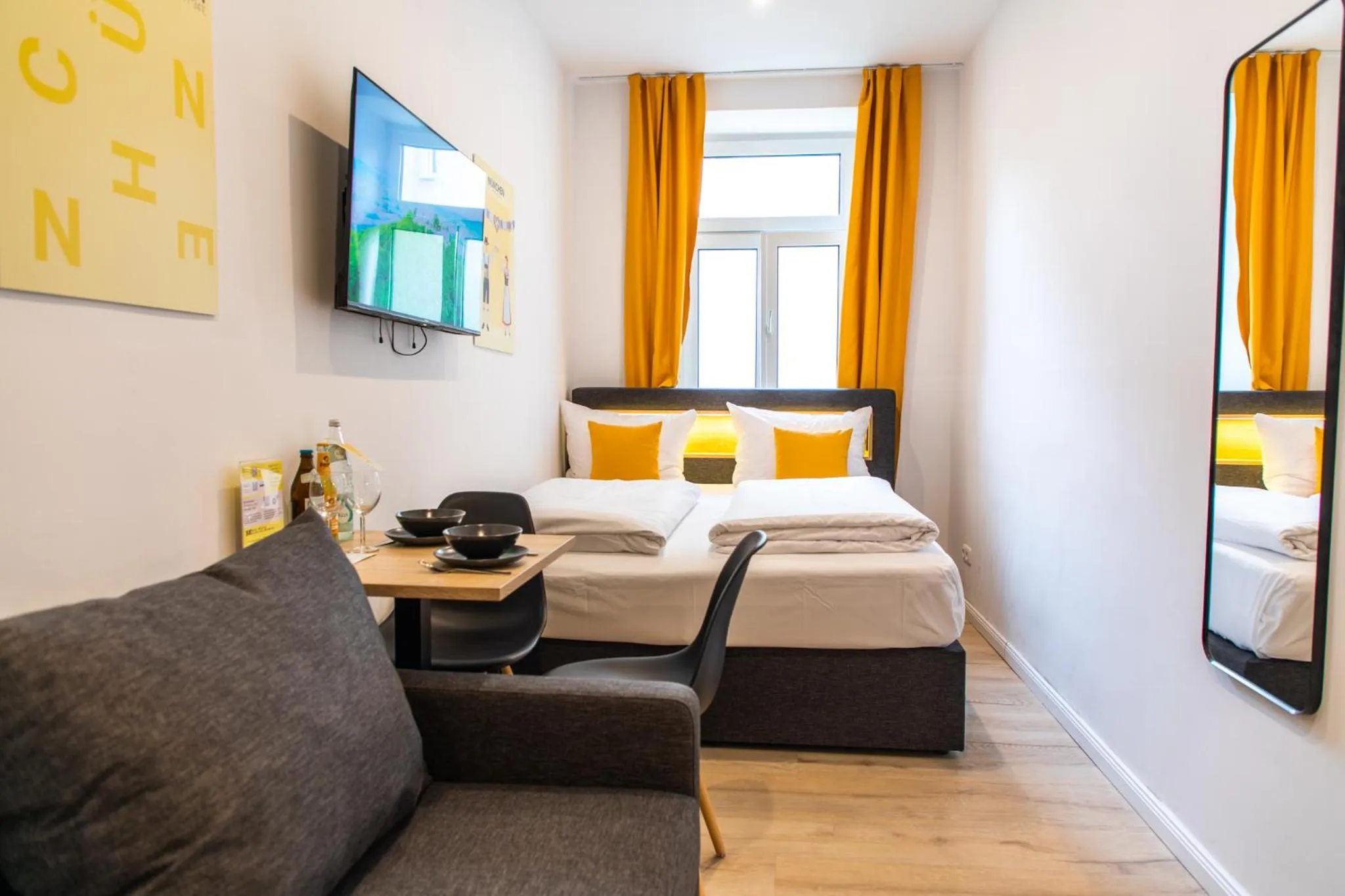 Bed in Servus Apartments by Homaris