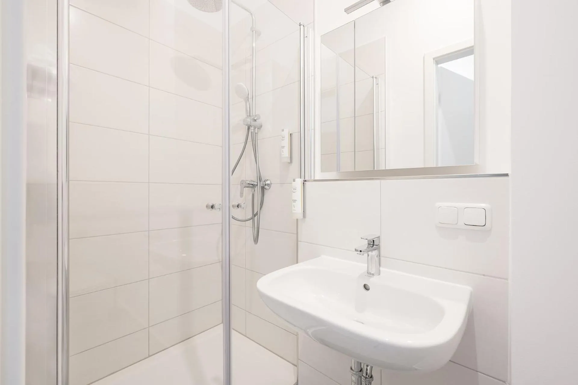 Bathroom in Servus Apartments by Homaris