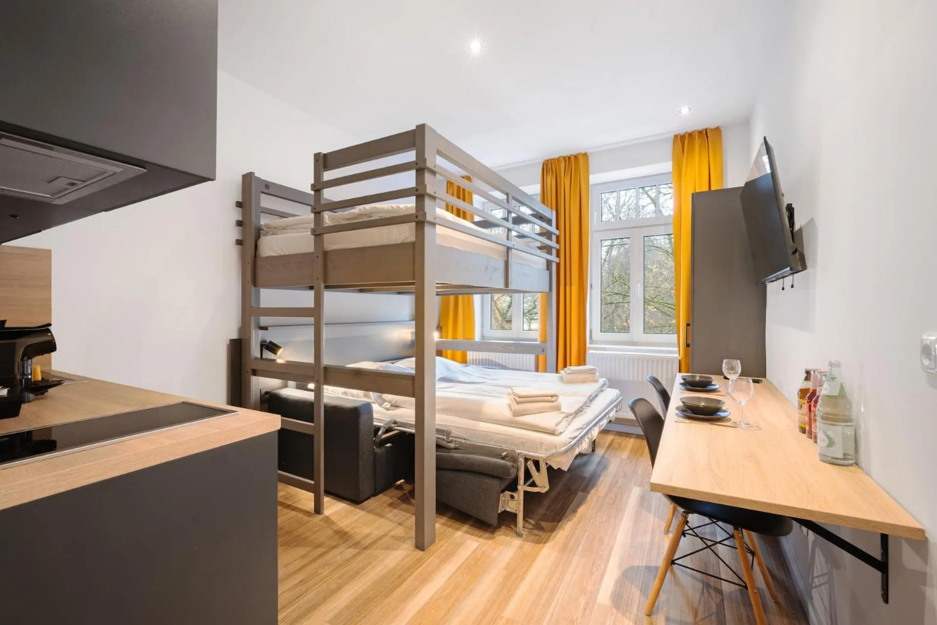 Bed in Servus Apartments by Homaris