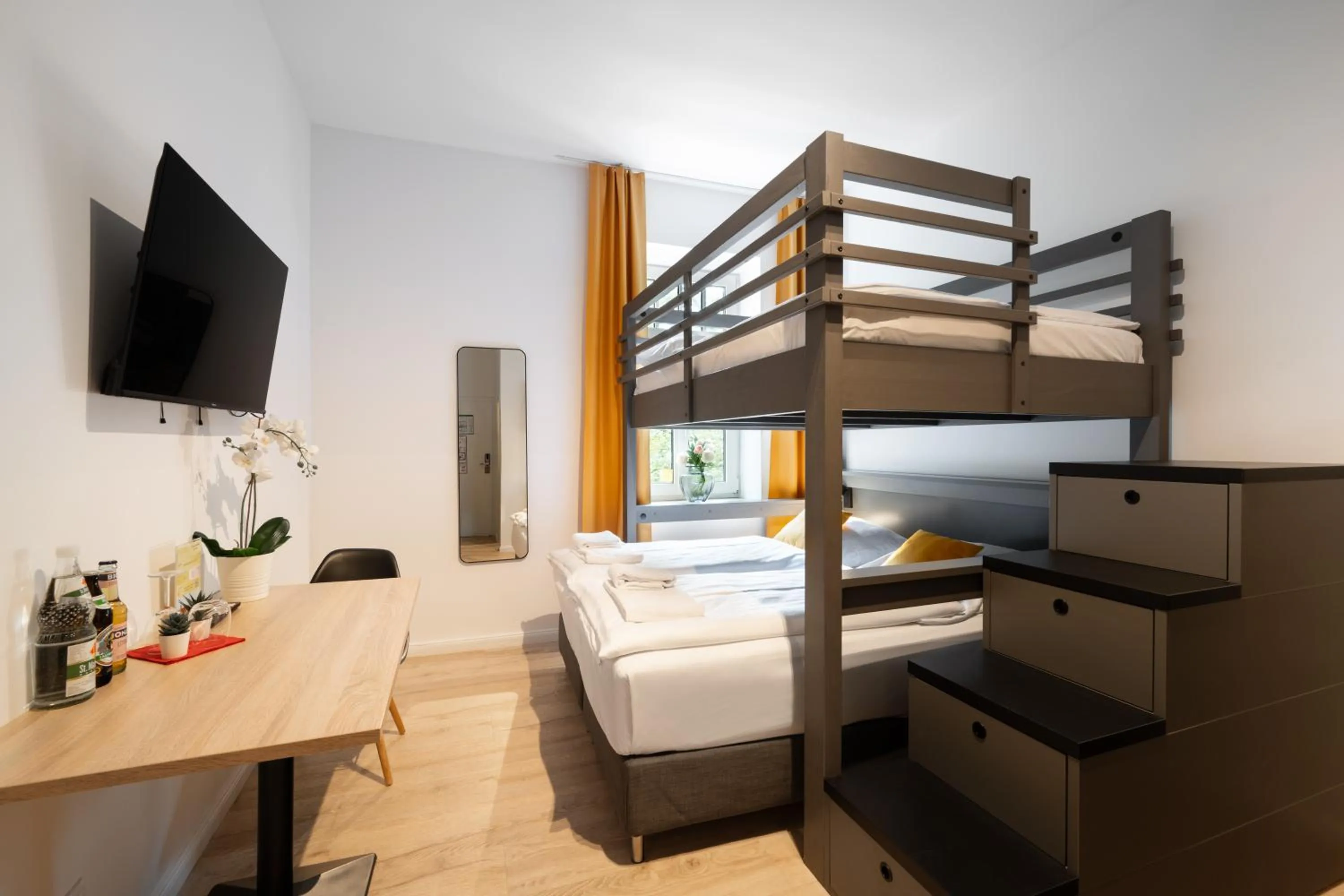 Bed in Servus Apartments by Homaris