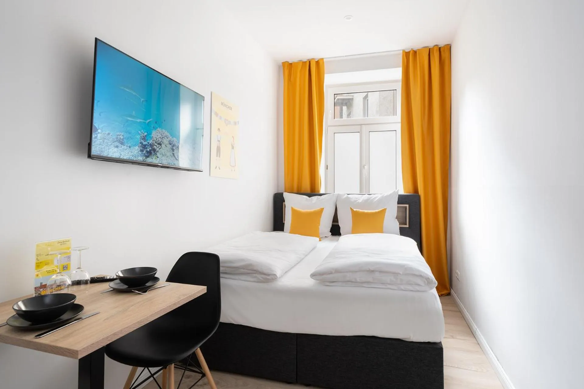 Bed in Servus Apartments by Homaris