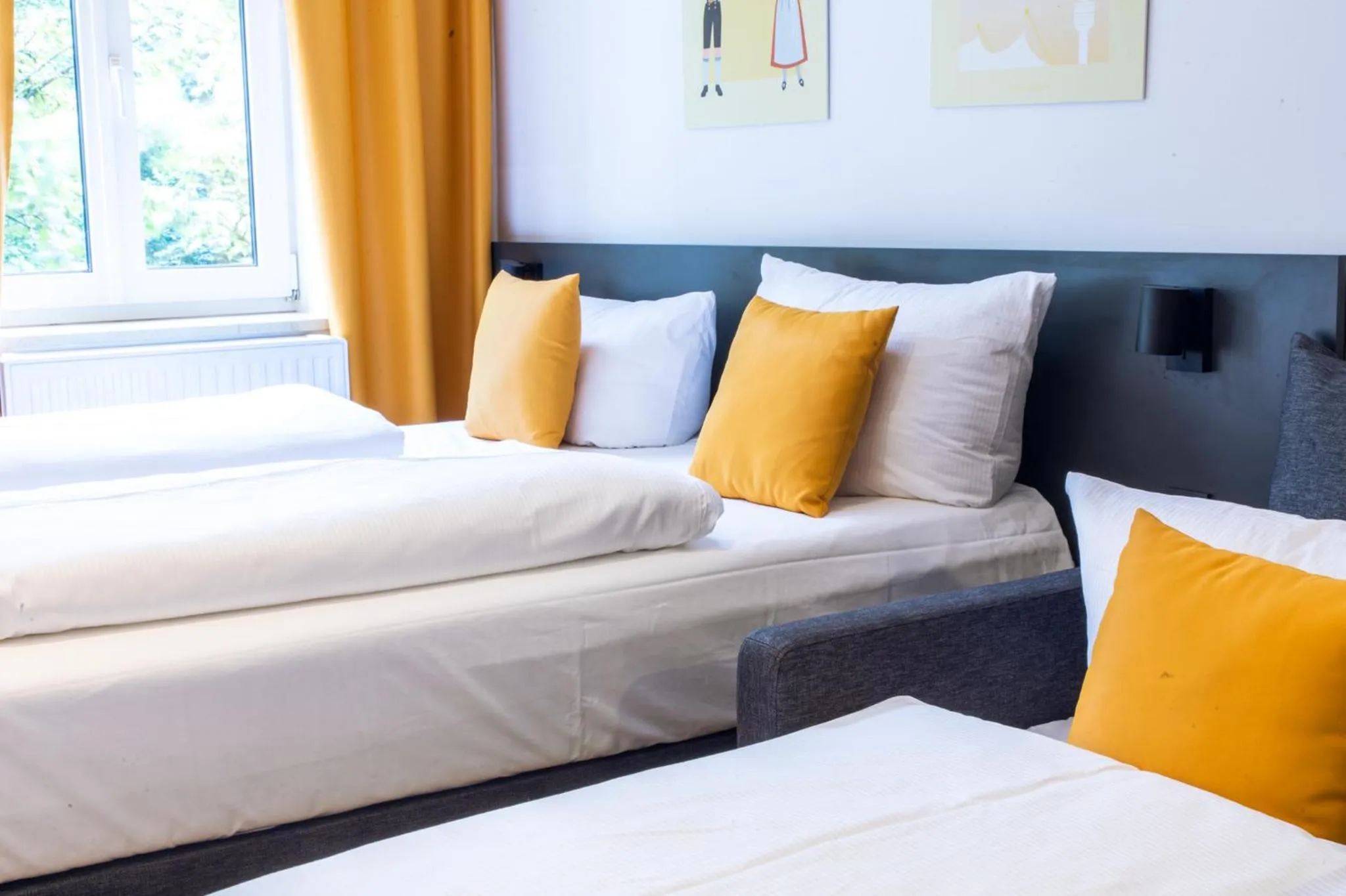 Bed in Servus Apartments by Homaris