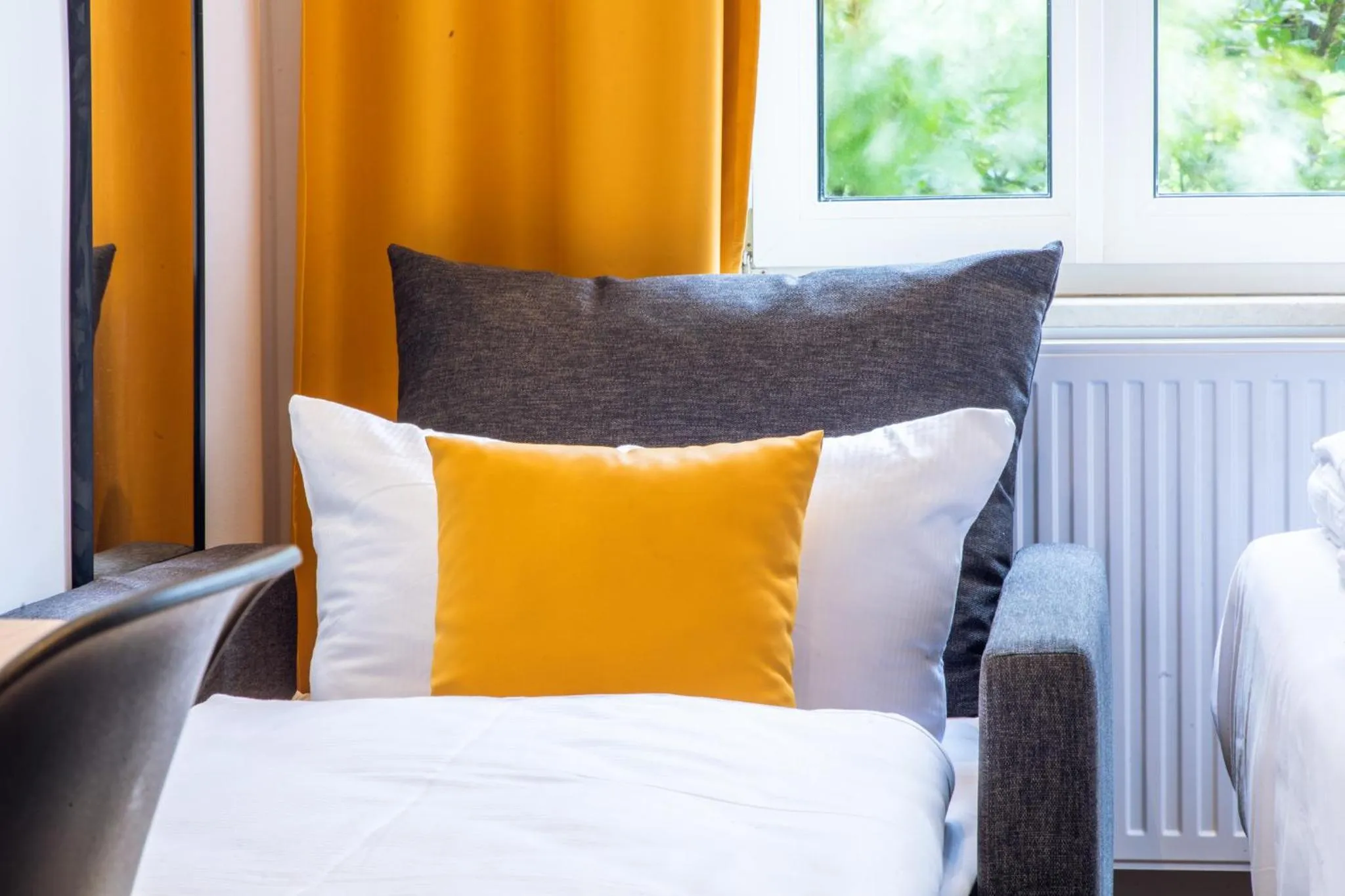 Bed in Servus Apartments by Homaris