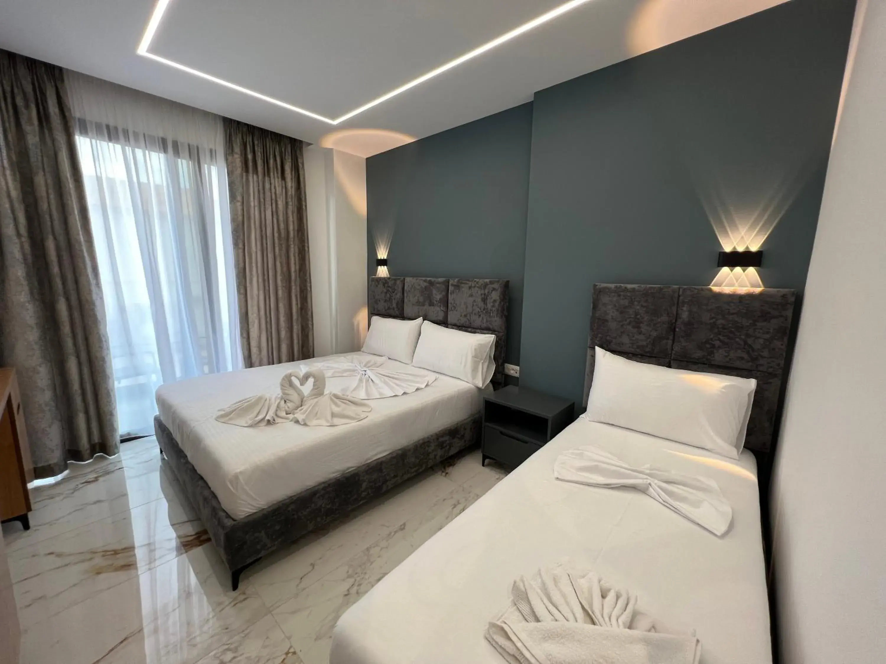 Deluxe Triple Room in Poseidon Hotel 2 Ksamil Deluxe Triple Room in Poseidon Hotel 2 Ksamil