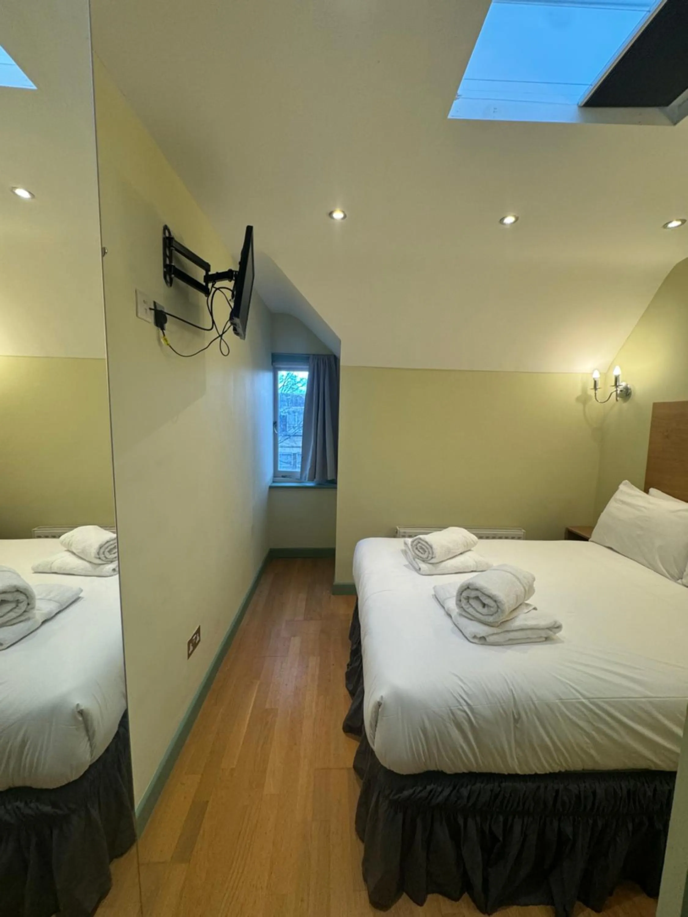 Photo of the whole room, Bed in 23