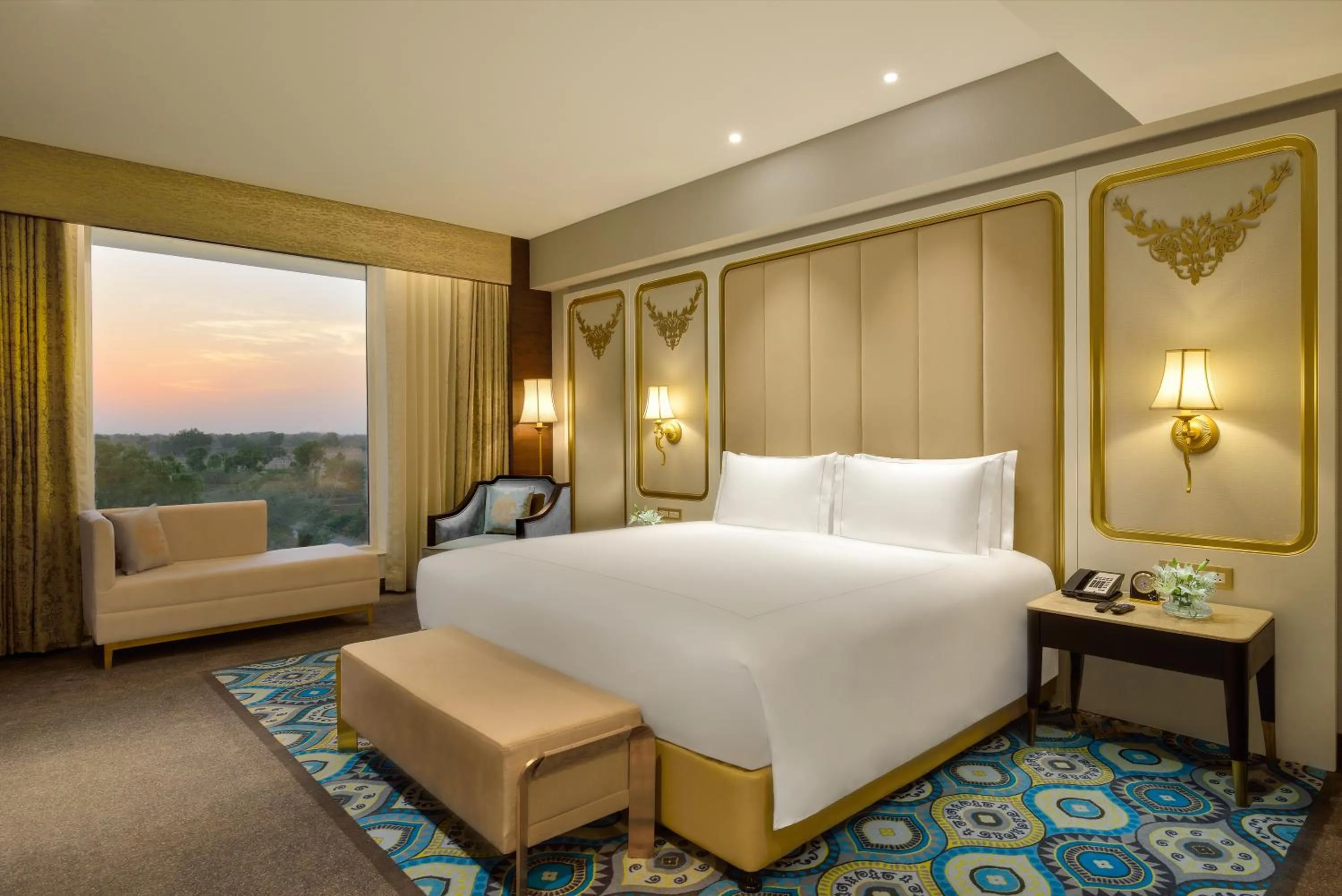Bed in Taj Gandhinagar Resort and Spa