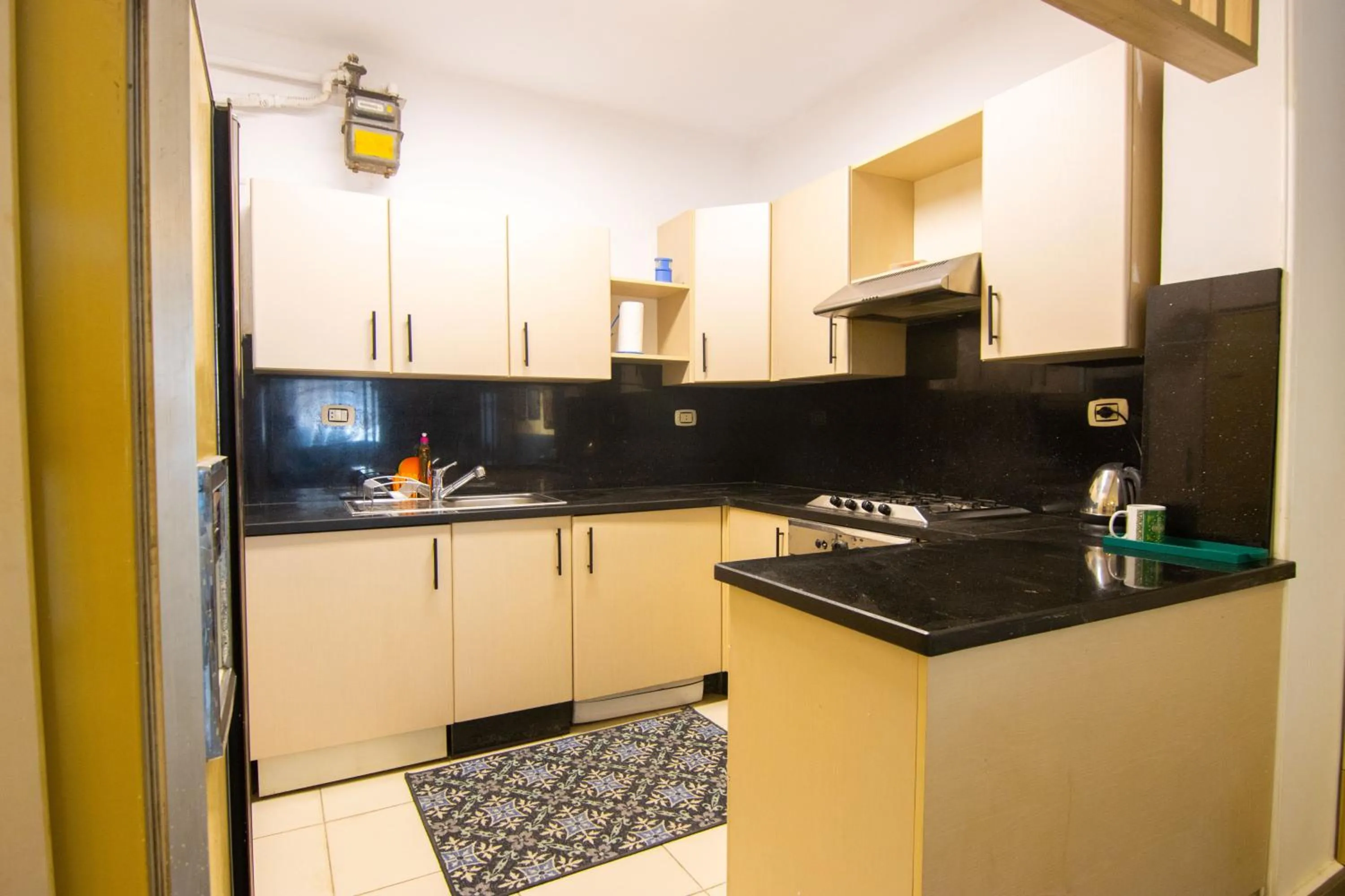 kitchen in Lovely 3BR Apartment in Heart of Mohandseen