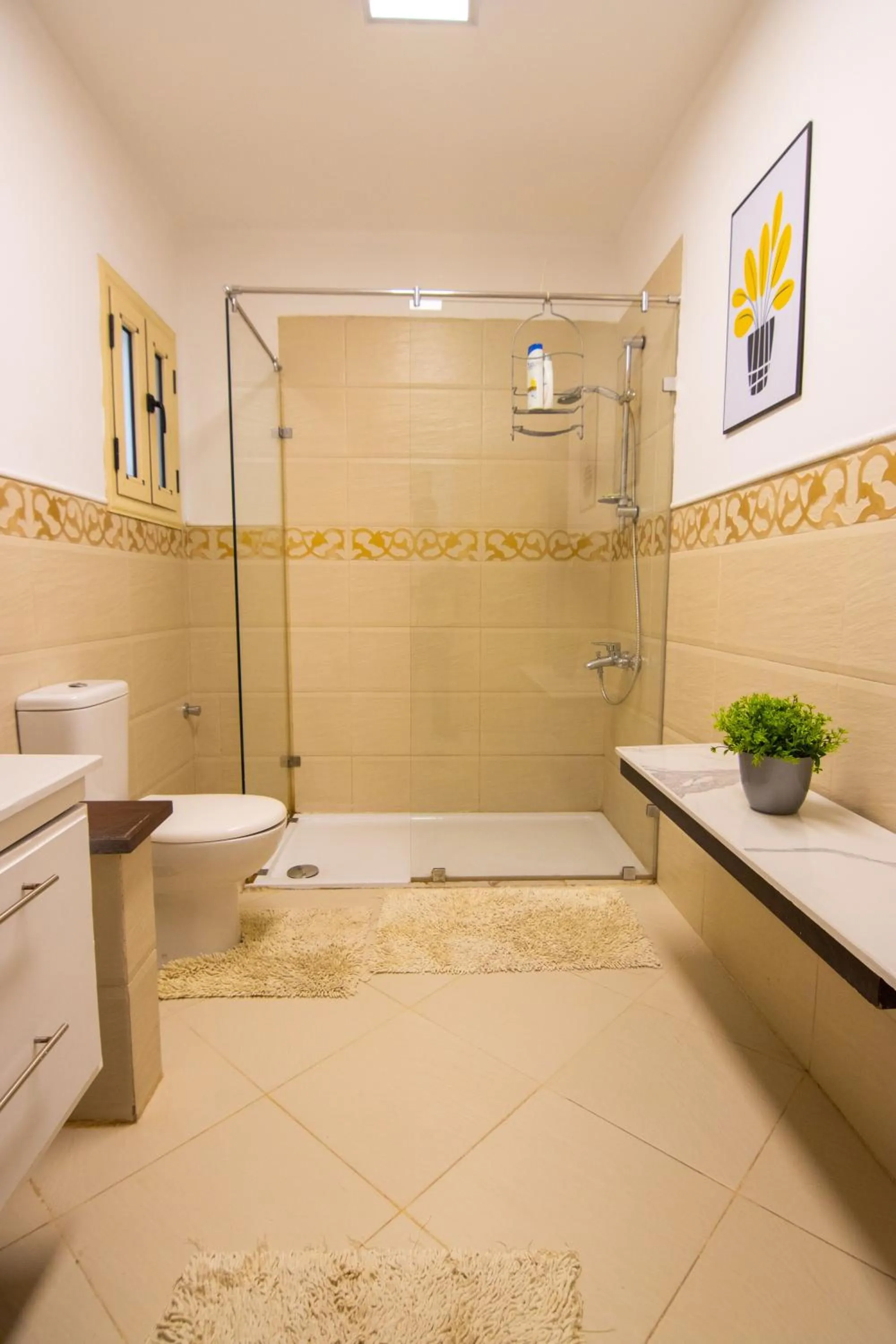 Shower in Lovely 3BR Apartment in Heart of Mohandseen