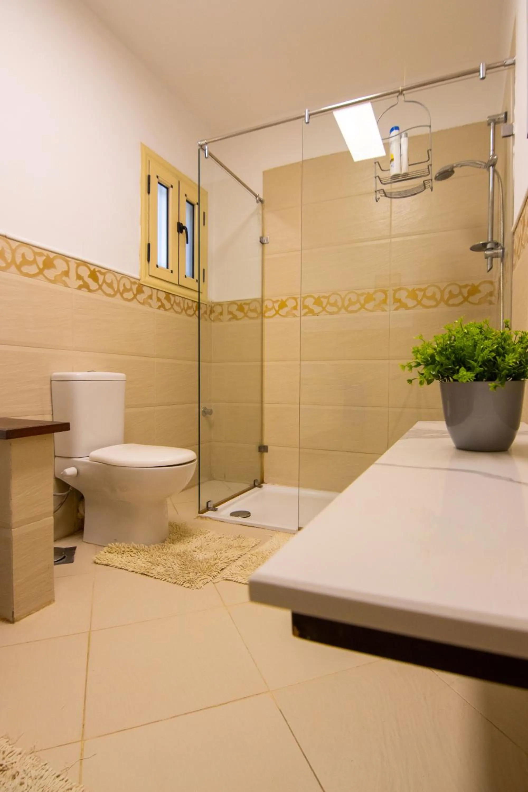 Shower in Lovely 3BR Apartment in Heart of Mohandseen