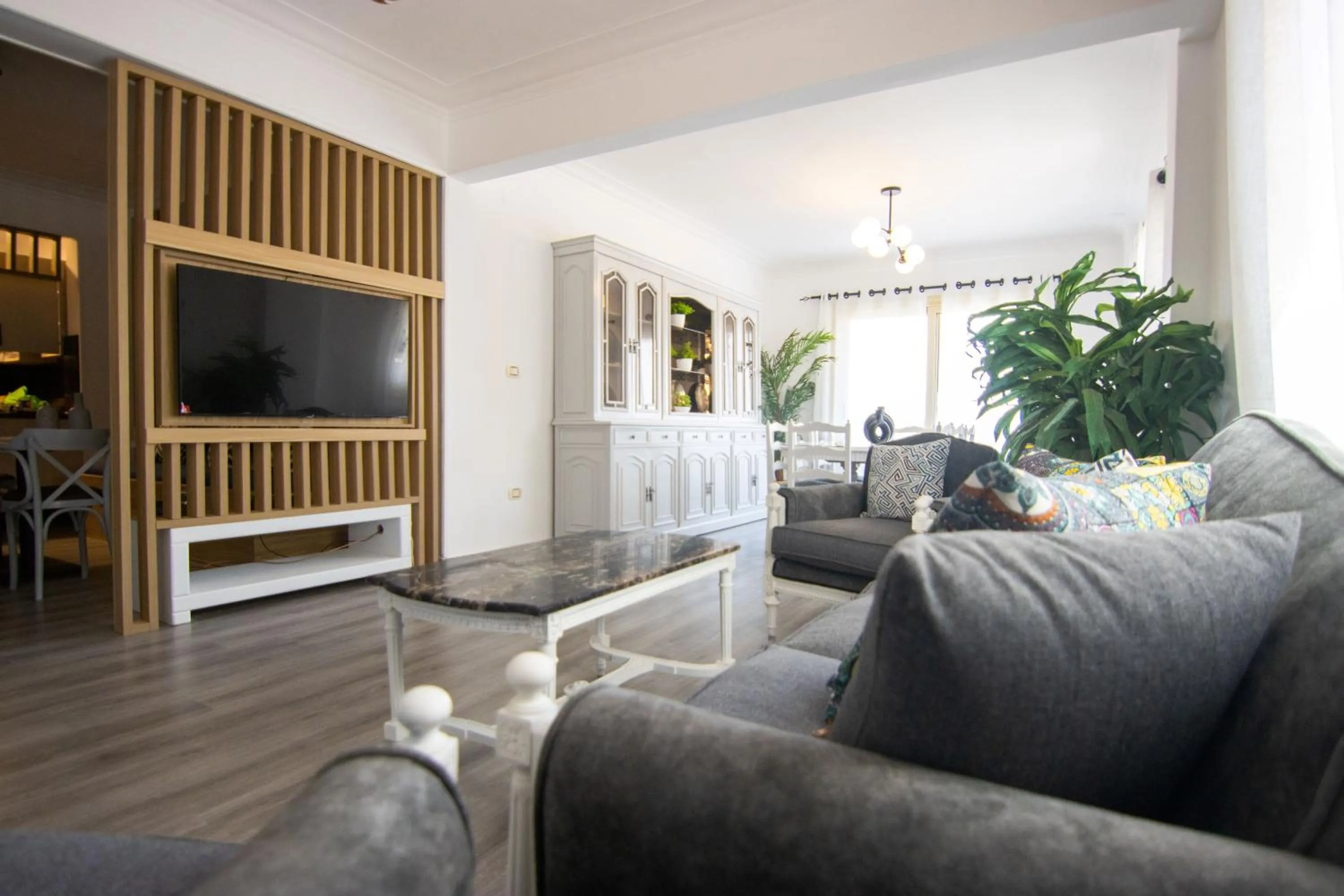 TV and multimedia in Lovely 3BR Apartment in Heart of Mohandseen