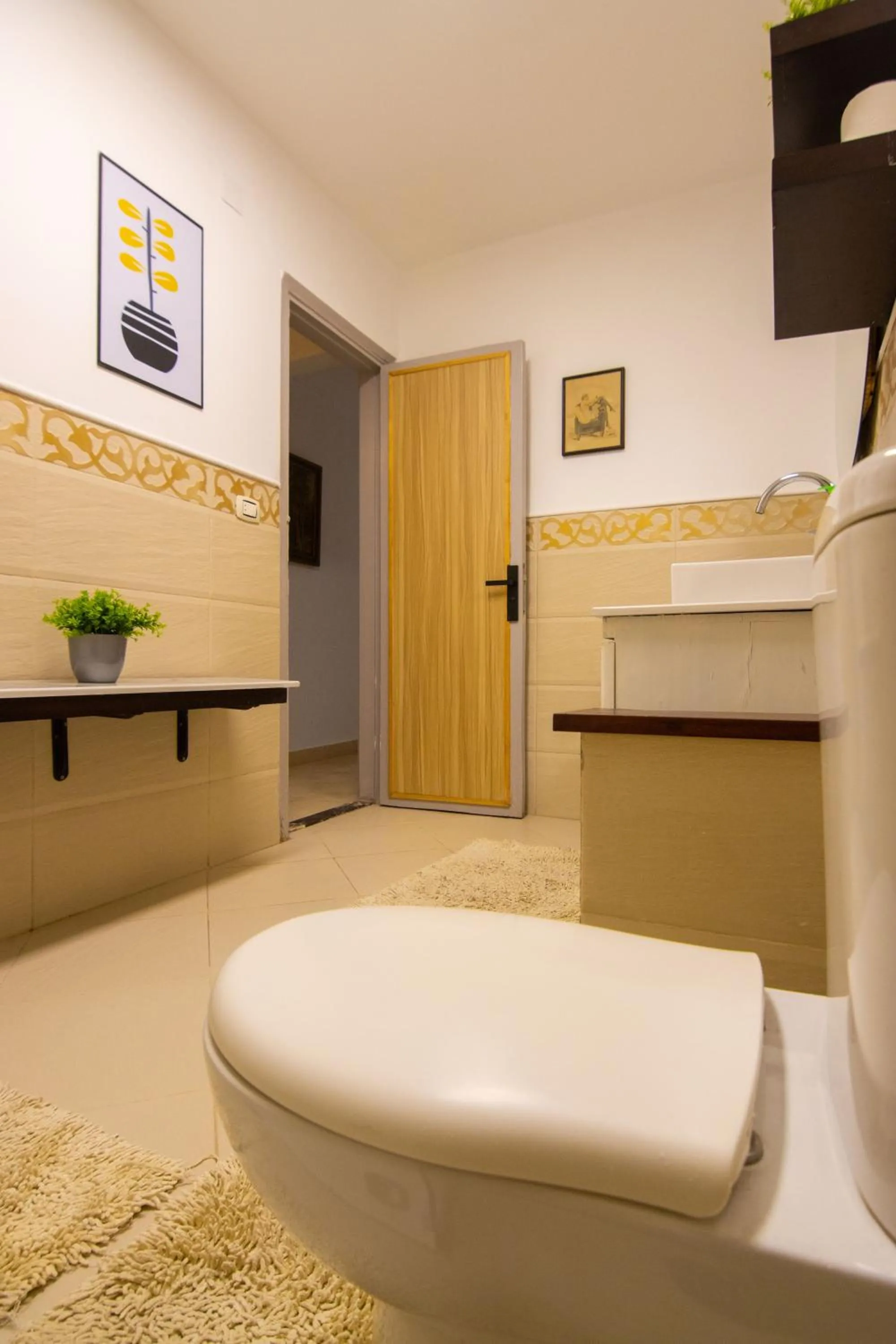 Toilet in Lovely 3BR Apartment in Heart of Mohandseen