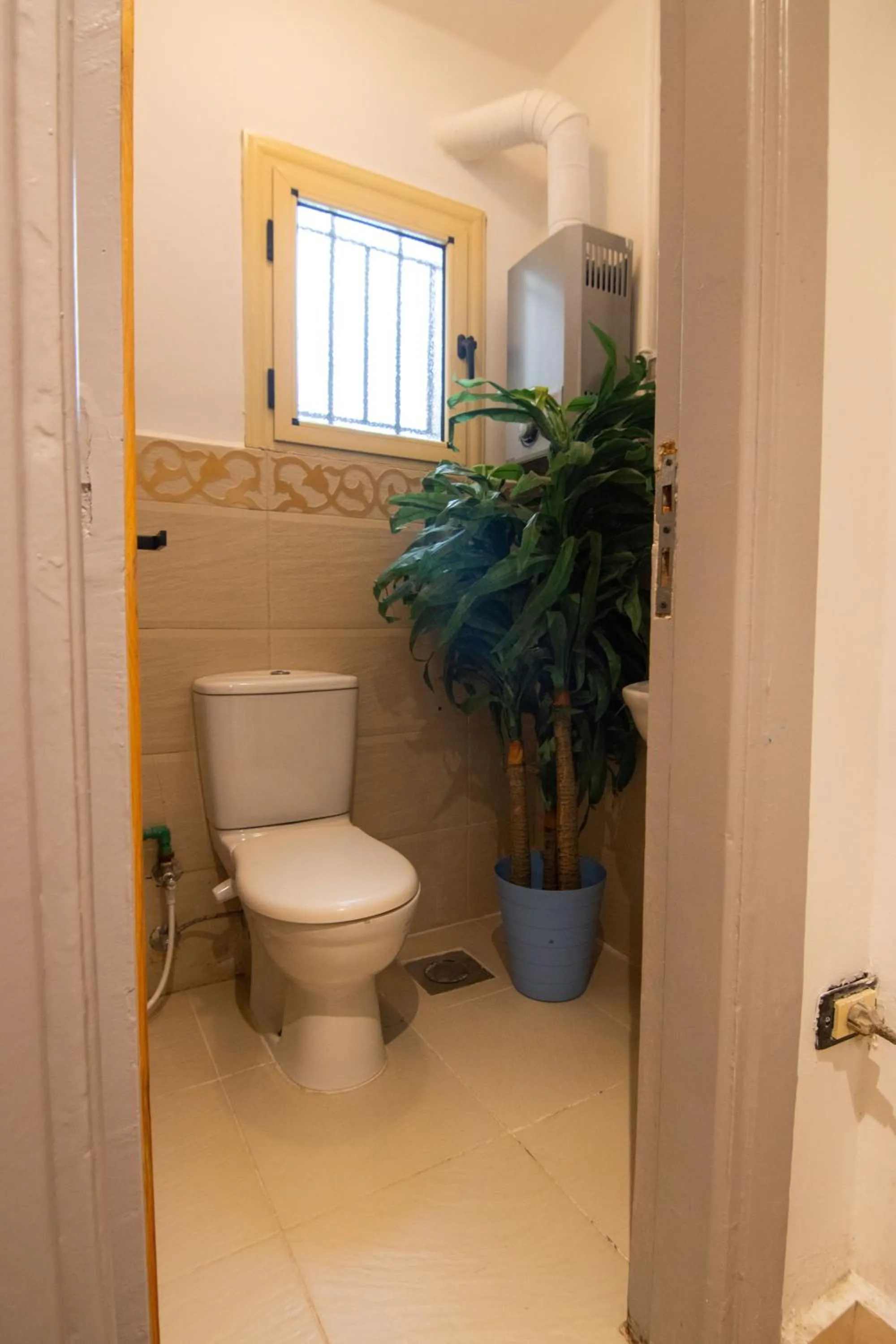 Toilet in Lovely 3BR Apartment in Heart of Mohandseen