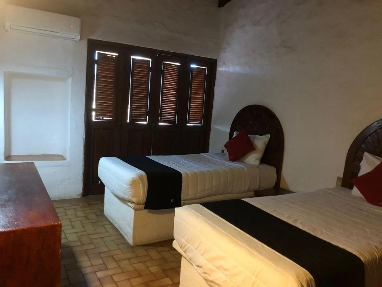 Bedroom in hotel plaza tucanes