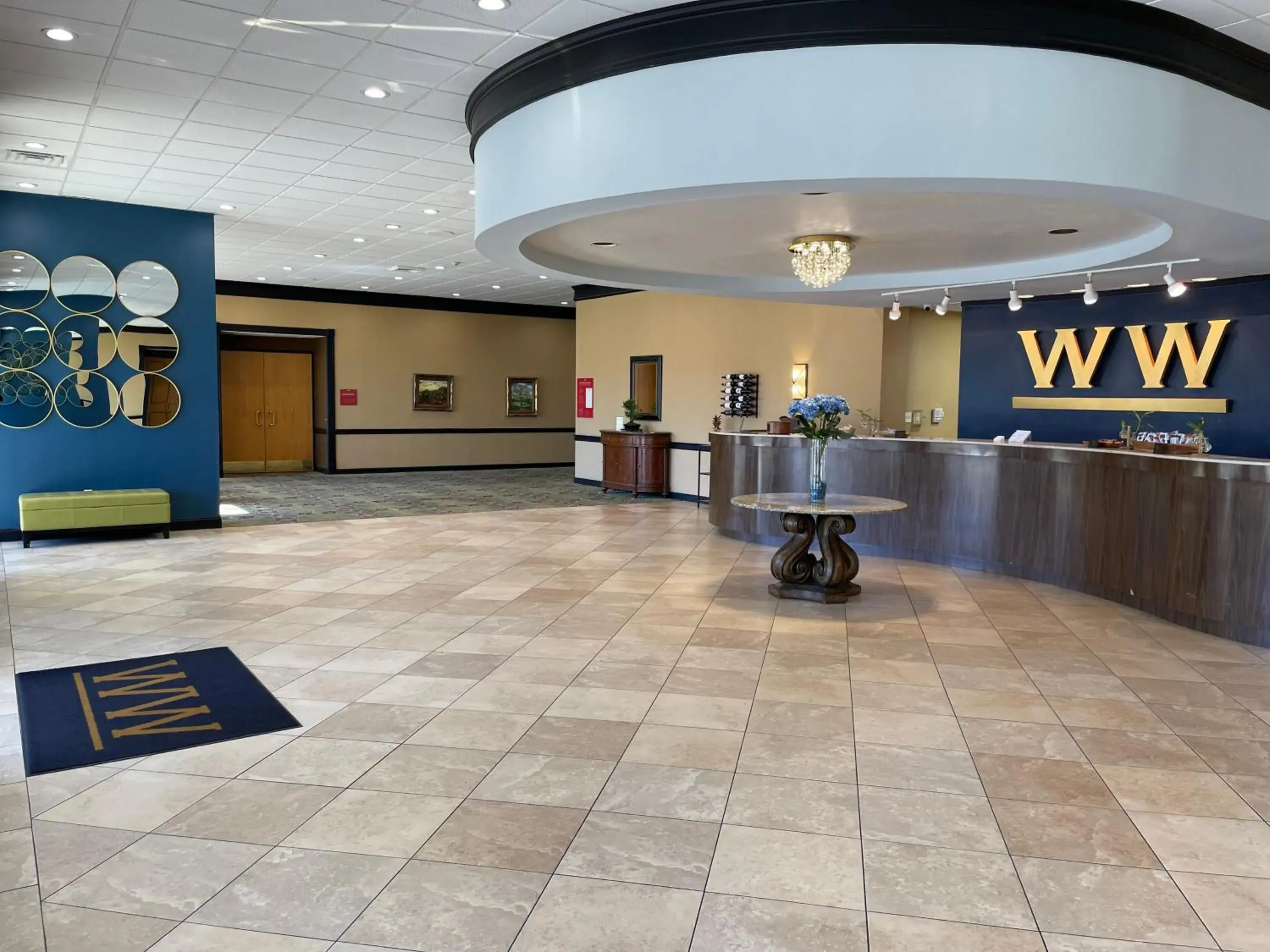 Lobby or reception in Historic Whispering Woods Hotel & Conference Center Lobby or reception in Historic Whispering Woods Hotel & Conference Center